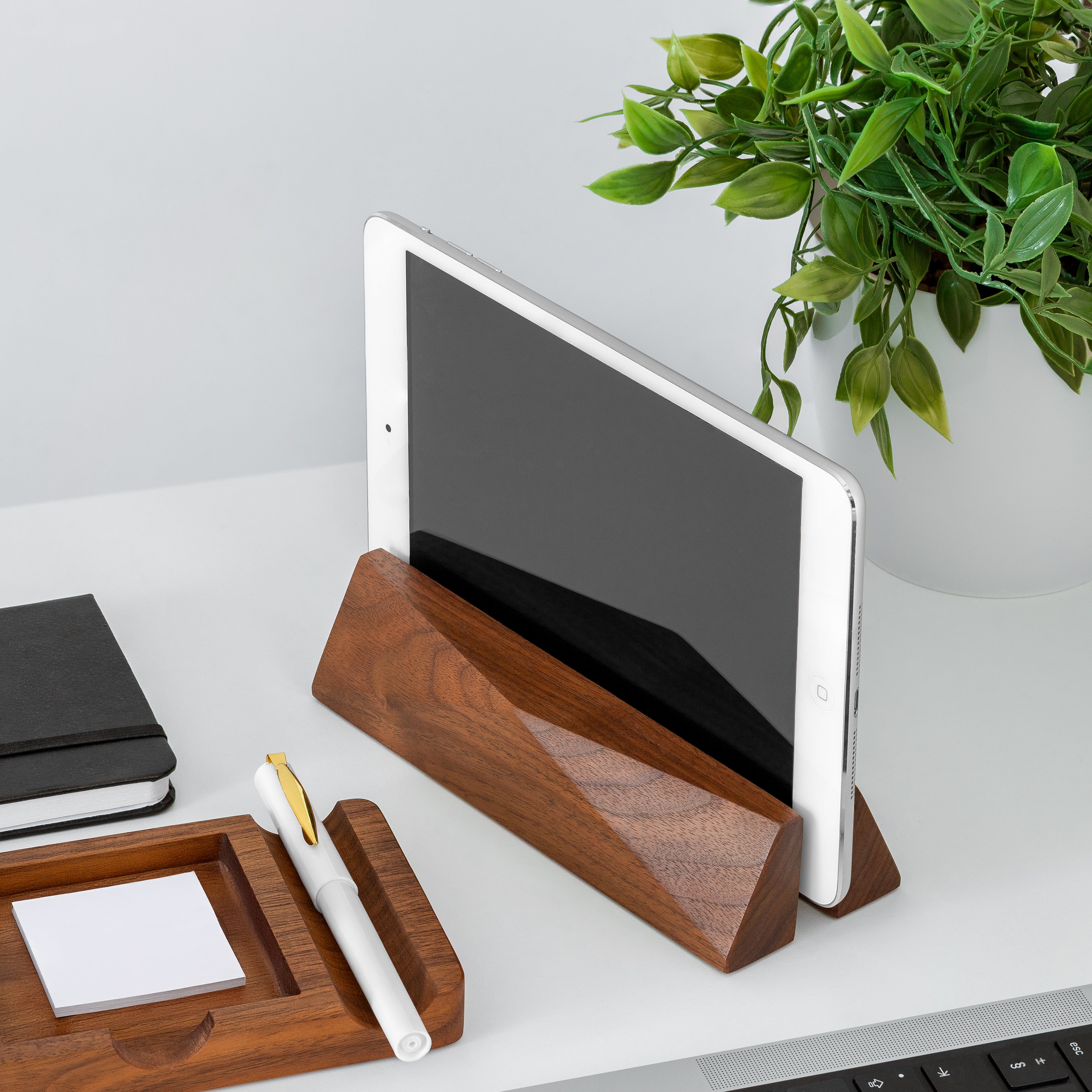 Elegant Laptop Dock in walnut, complementing a clean workspace with an iPad and stationery essentials.