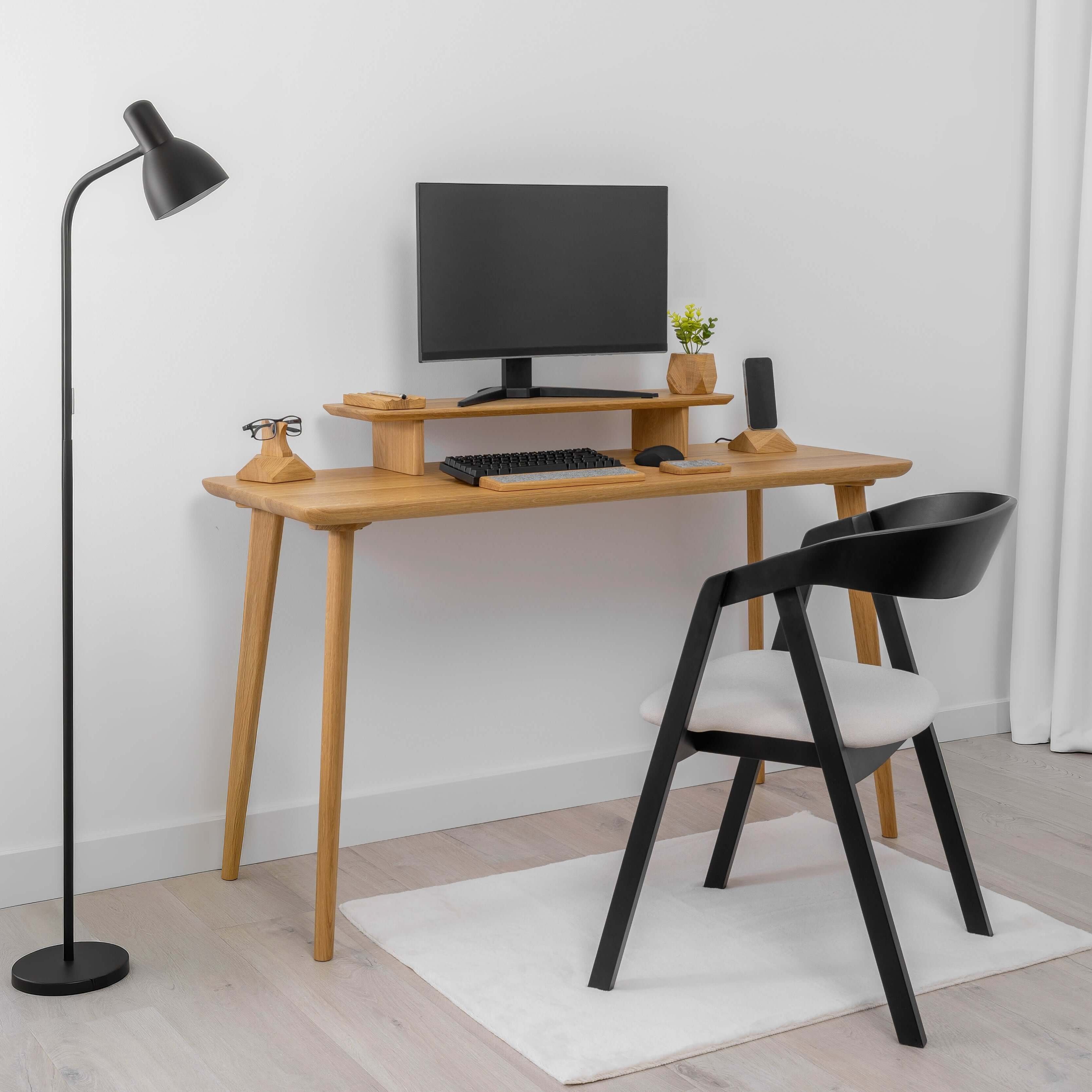 Minimalist workspace featuring a solid wood Desk ORIGIN with computer, lamp, and stylish chair in clean Scandinavian design.