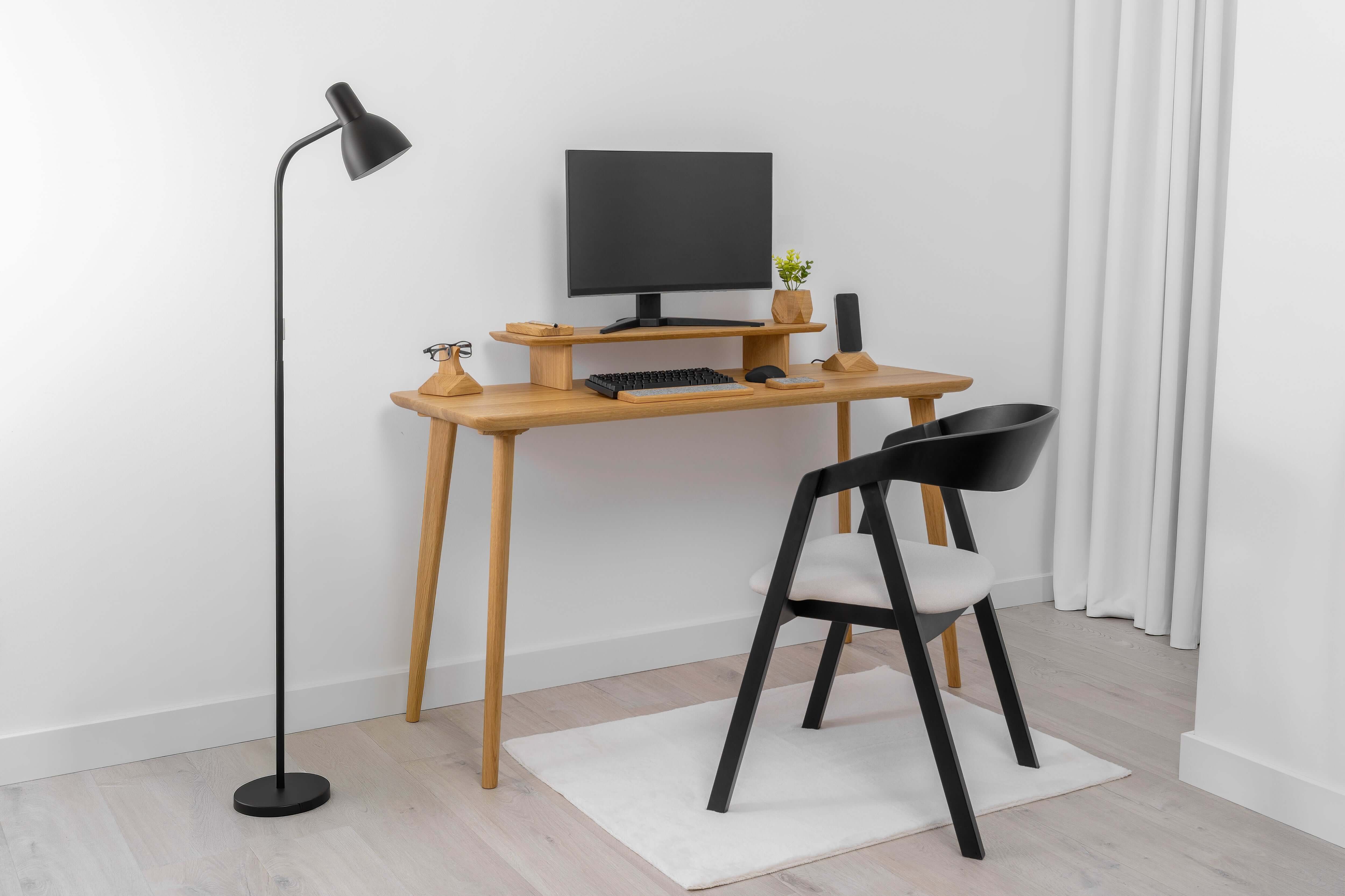 Minimalist workspace featuring a solid wood Desk ORIGIN with computer, lamp, and stylish chair in clean Scandinavian design.