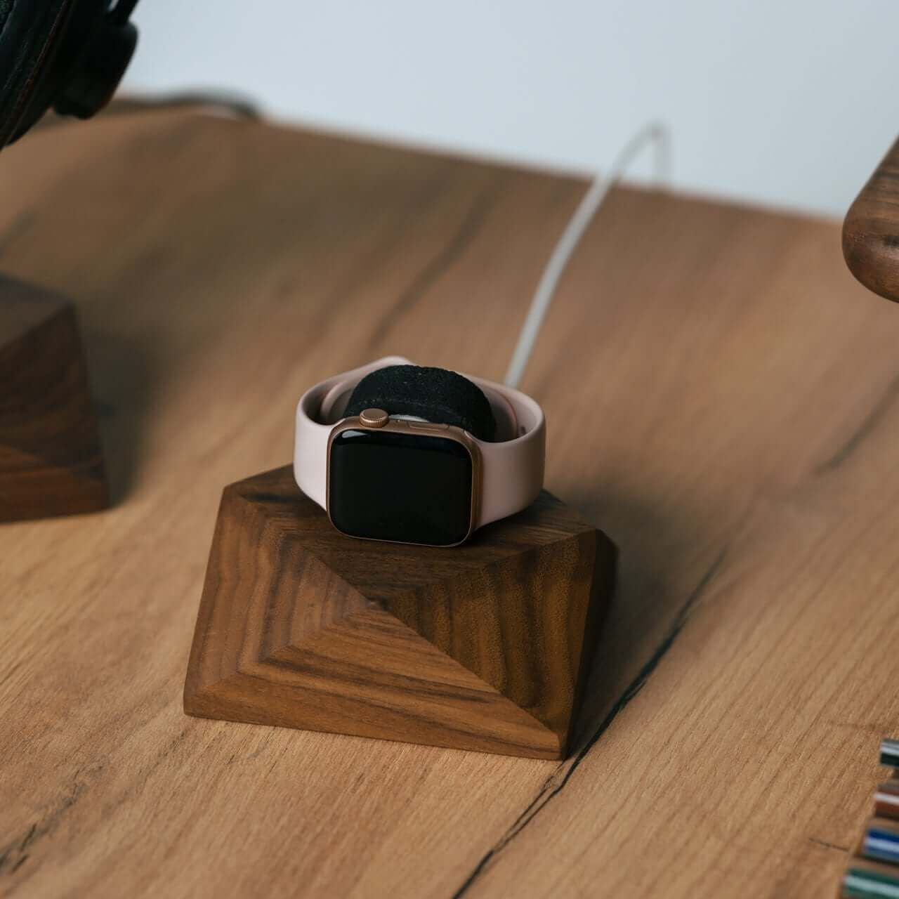 Apple Watch charging stand in walnut wood with a smartwatch resting, perfect for organization and style.