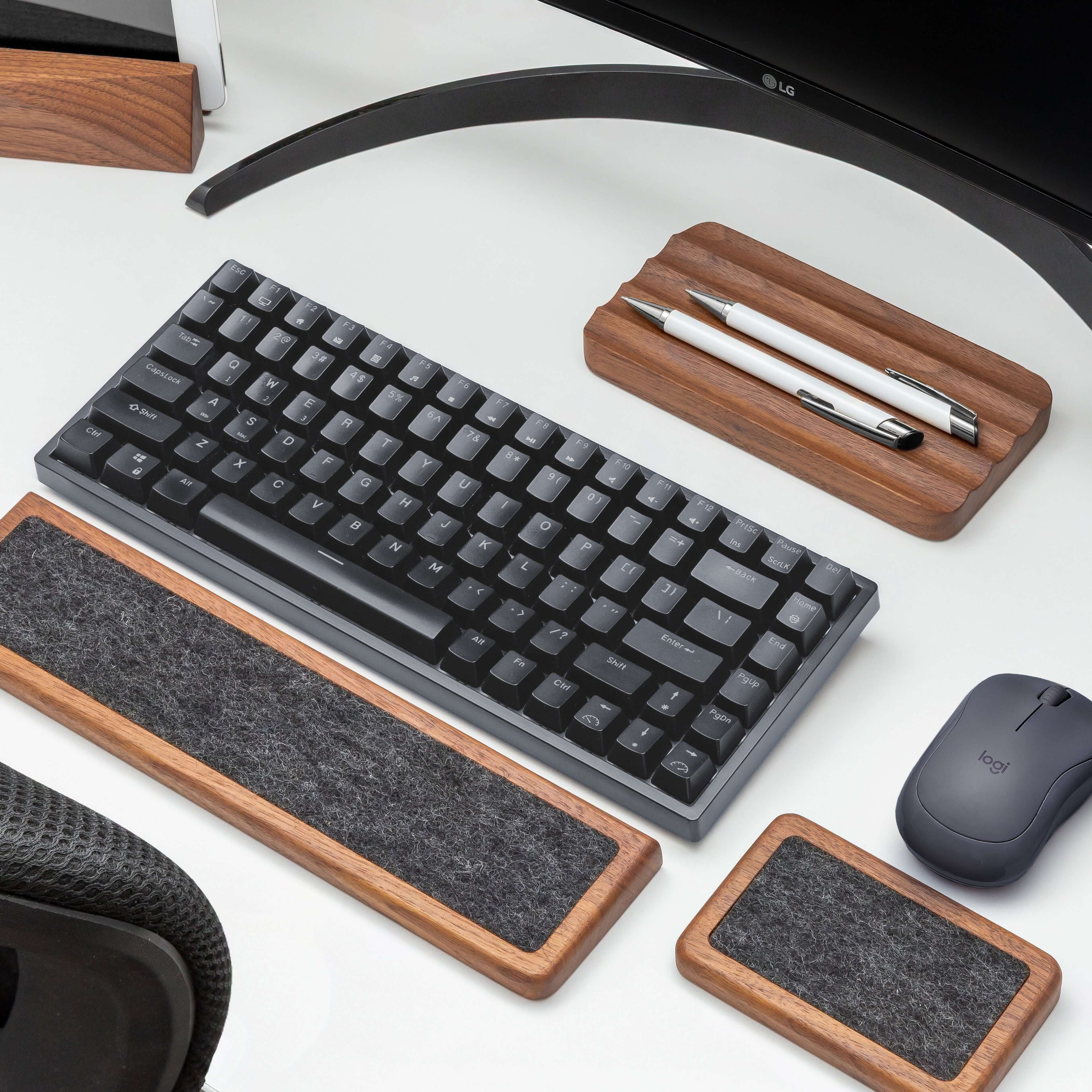 Keyboard wrist rest set in walnut combined with keyboard and mouse for ergonomic comfort on a workspace.