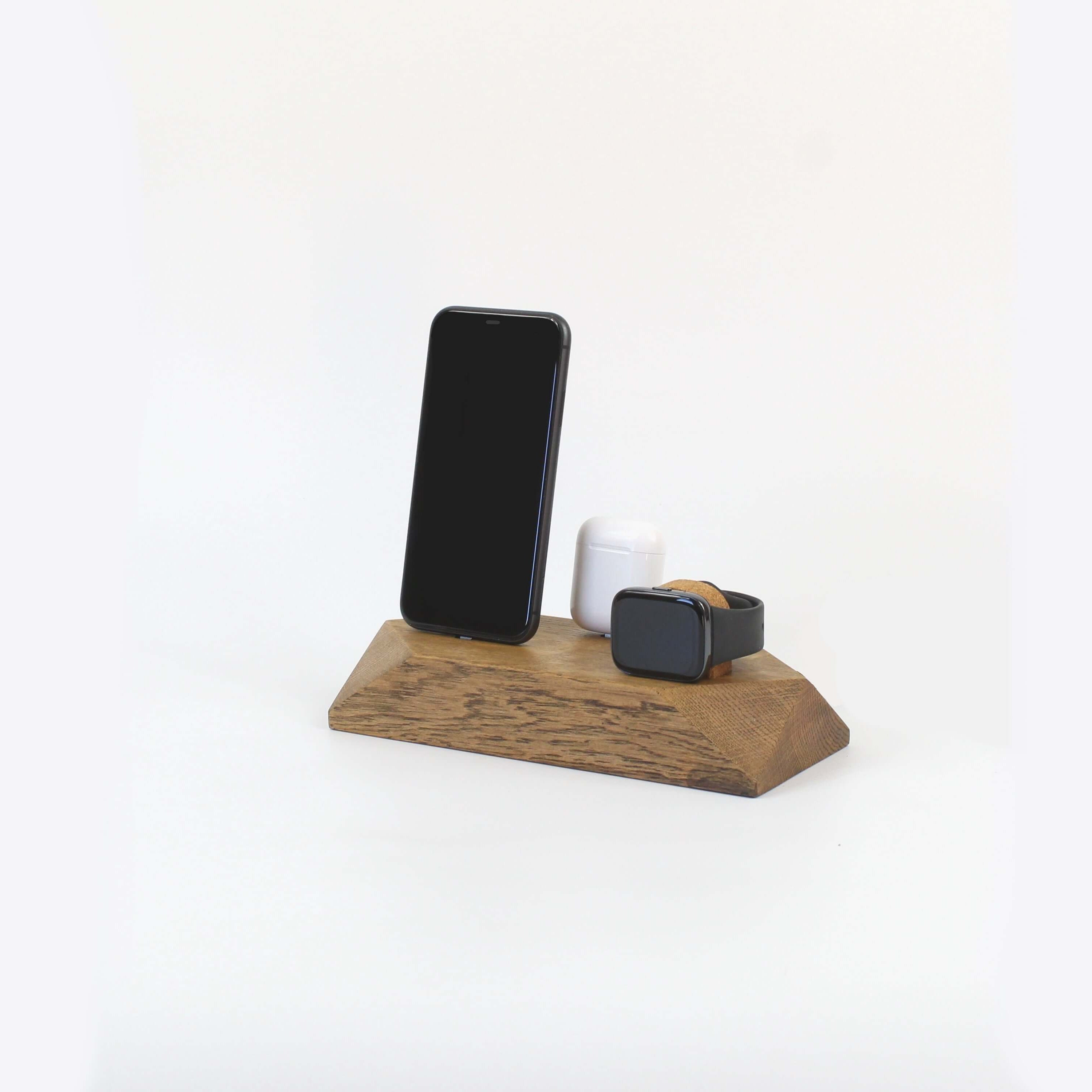 Triple Docking Station in brown oak, holding two smartphones and an Apple Watch, perfect for organization and style.