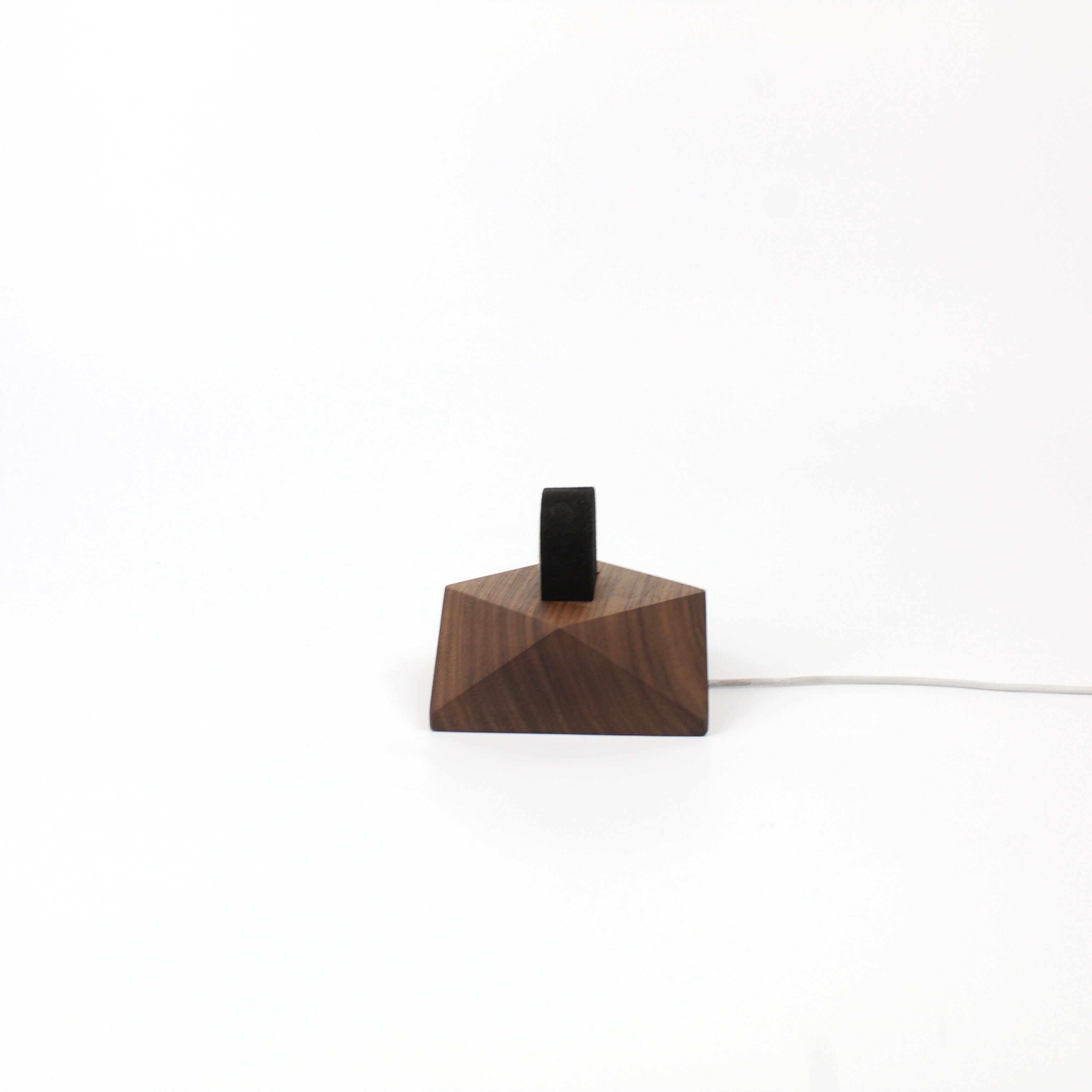 Apple Watch charging stand in walnut wood, elegantly designed for organization and style on desk or nightstand.