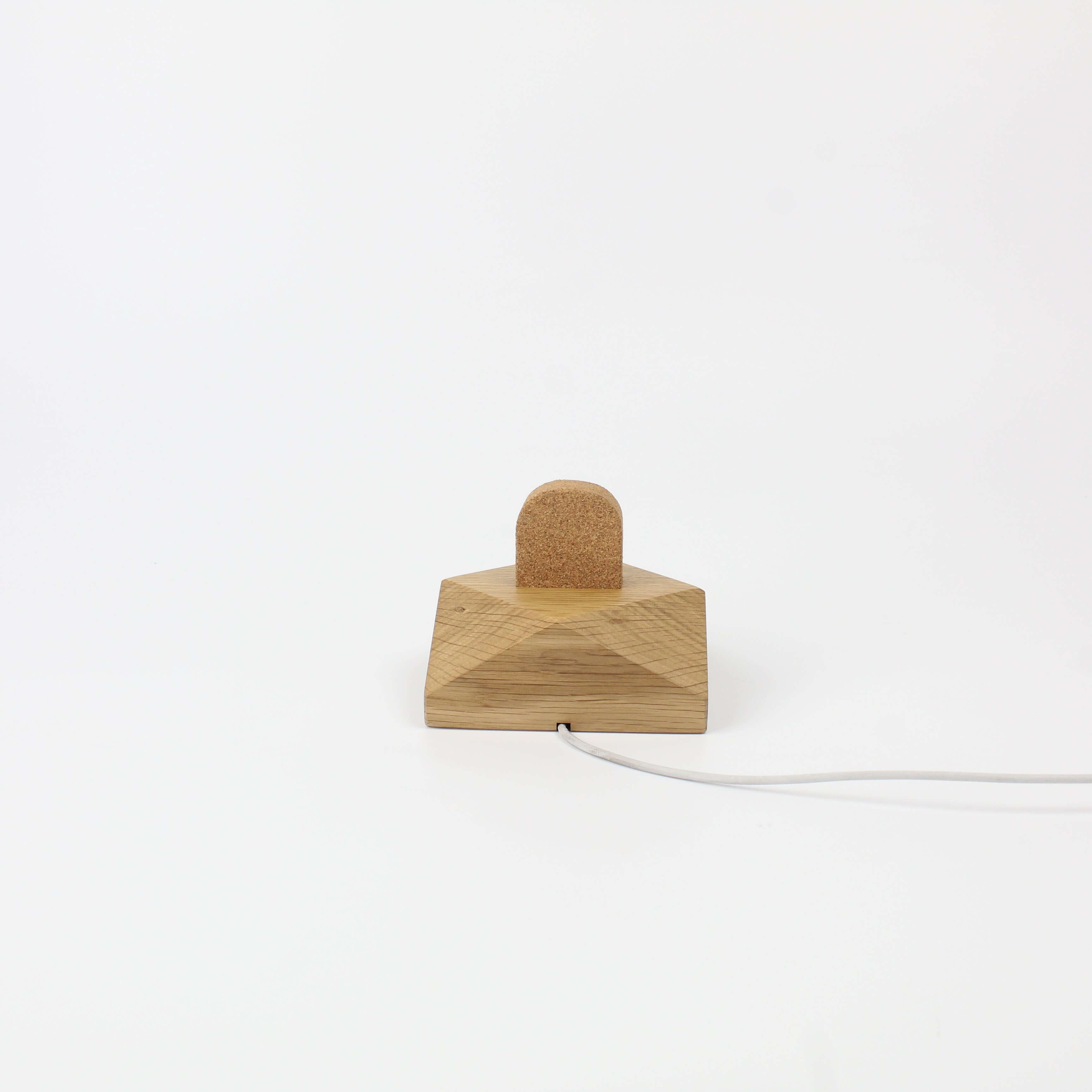 Apple Watch charging stand in oak wood, stylish design for desk organization and easy charging.