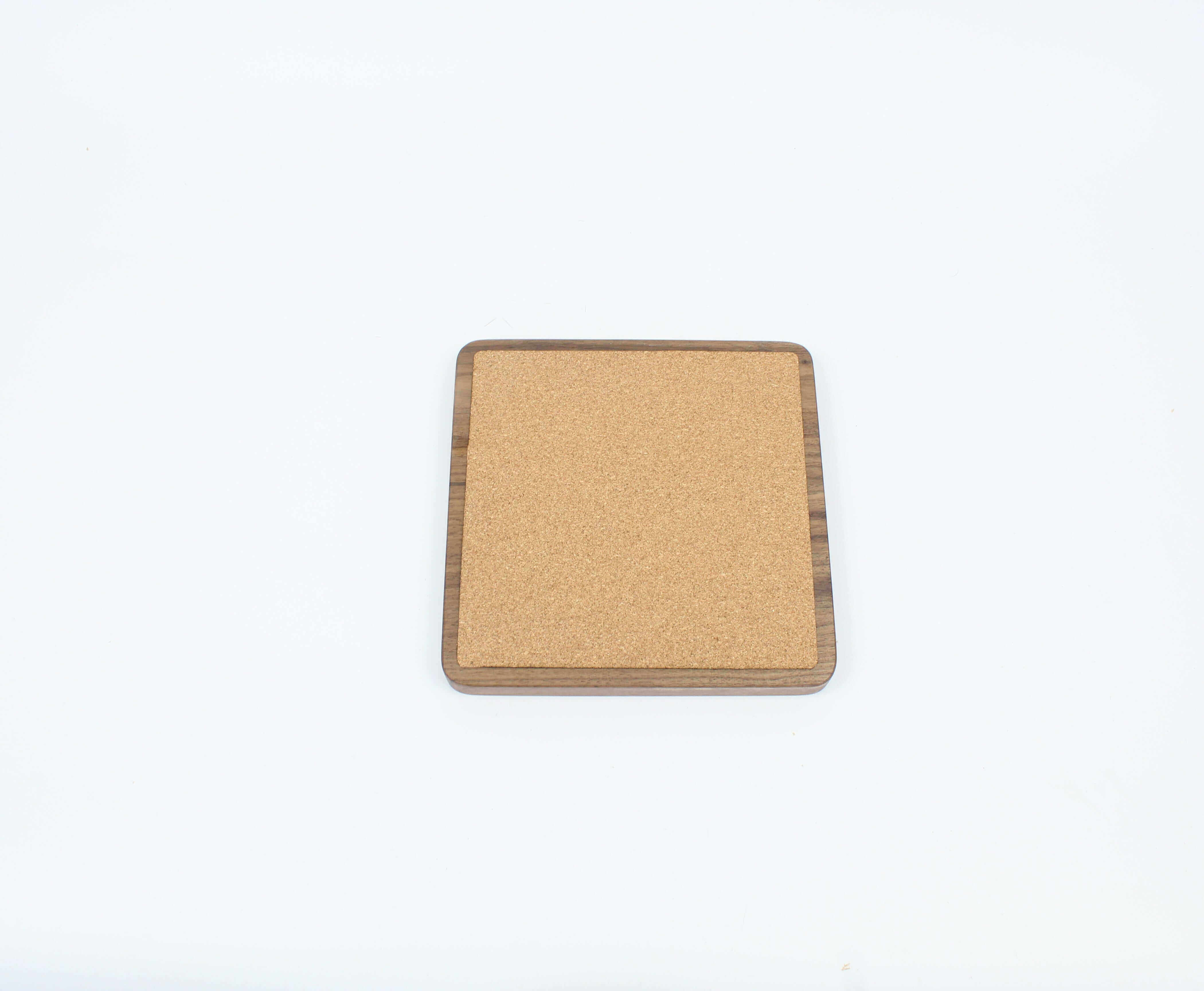 Square cork and wood desk tray for organizing essentials, ideal for a tidy workspace and elegant desk accessories.