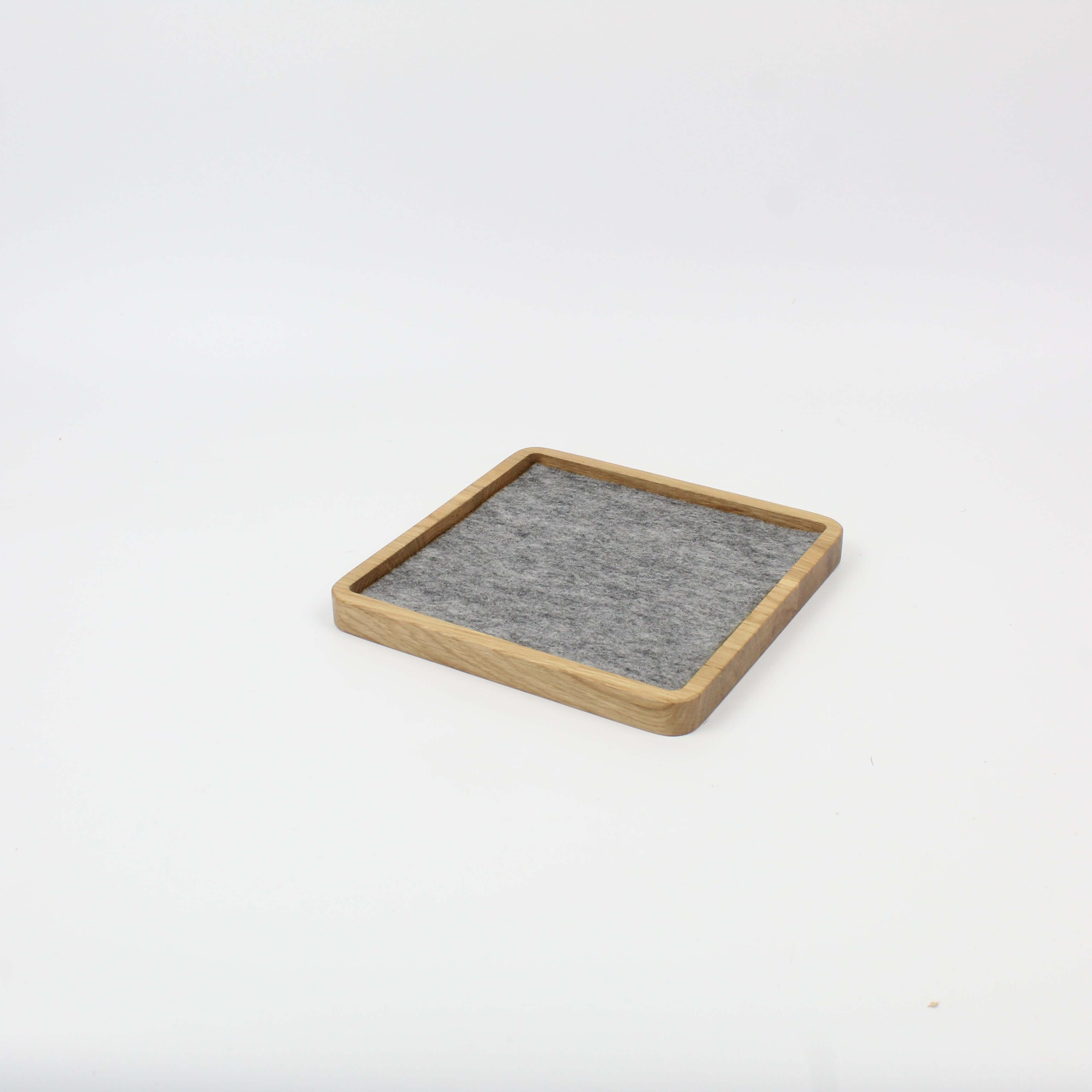 Practical square oak catch all tray for organizing desk essentials, featuring a felt lining for added elegance.