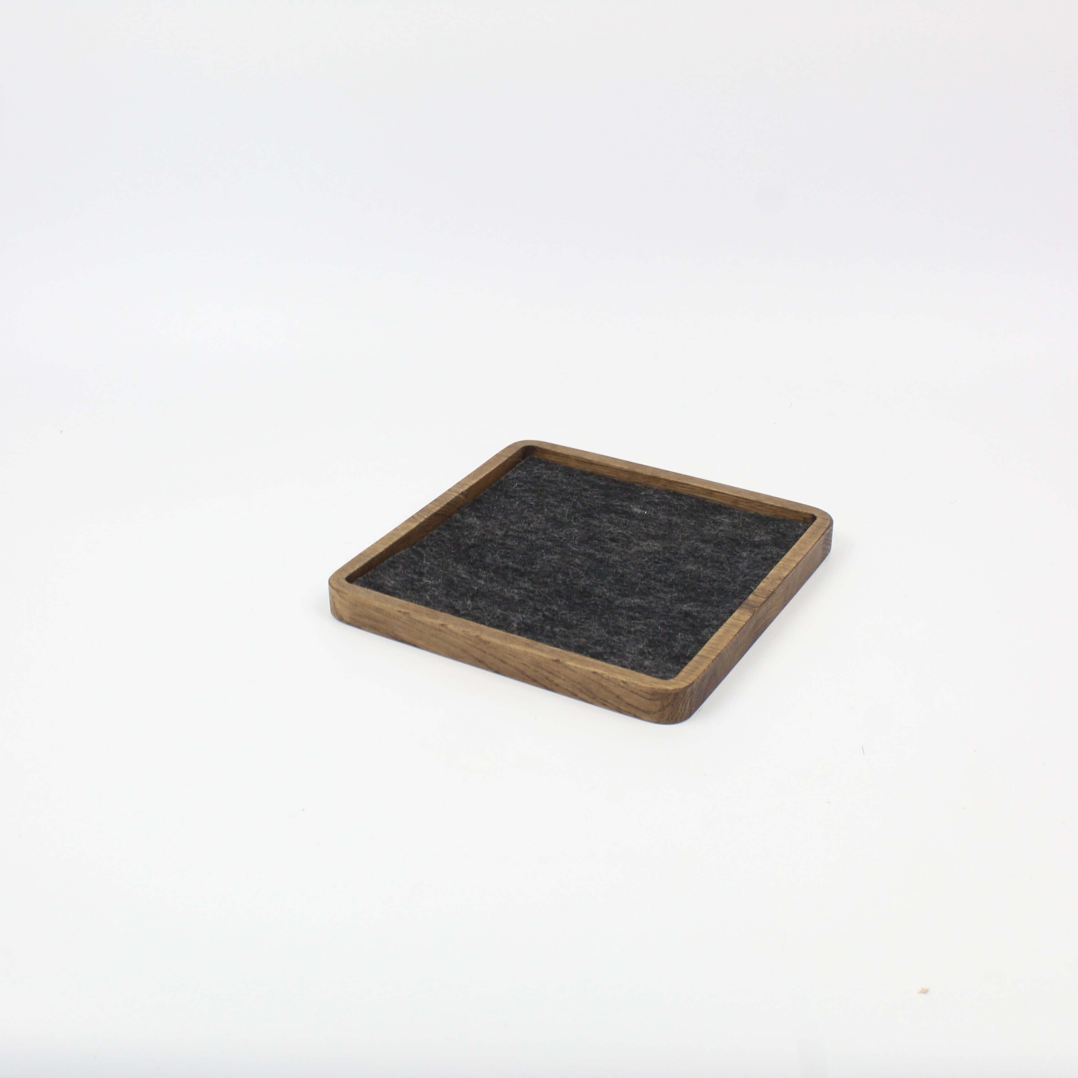 Brown oak square catch-all tray with felt lining, ideal for organizing desk accessories and keeping workspace tidy.