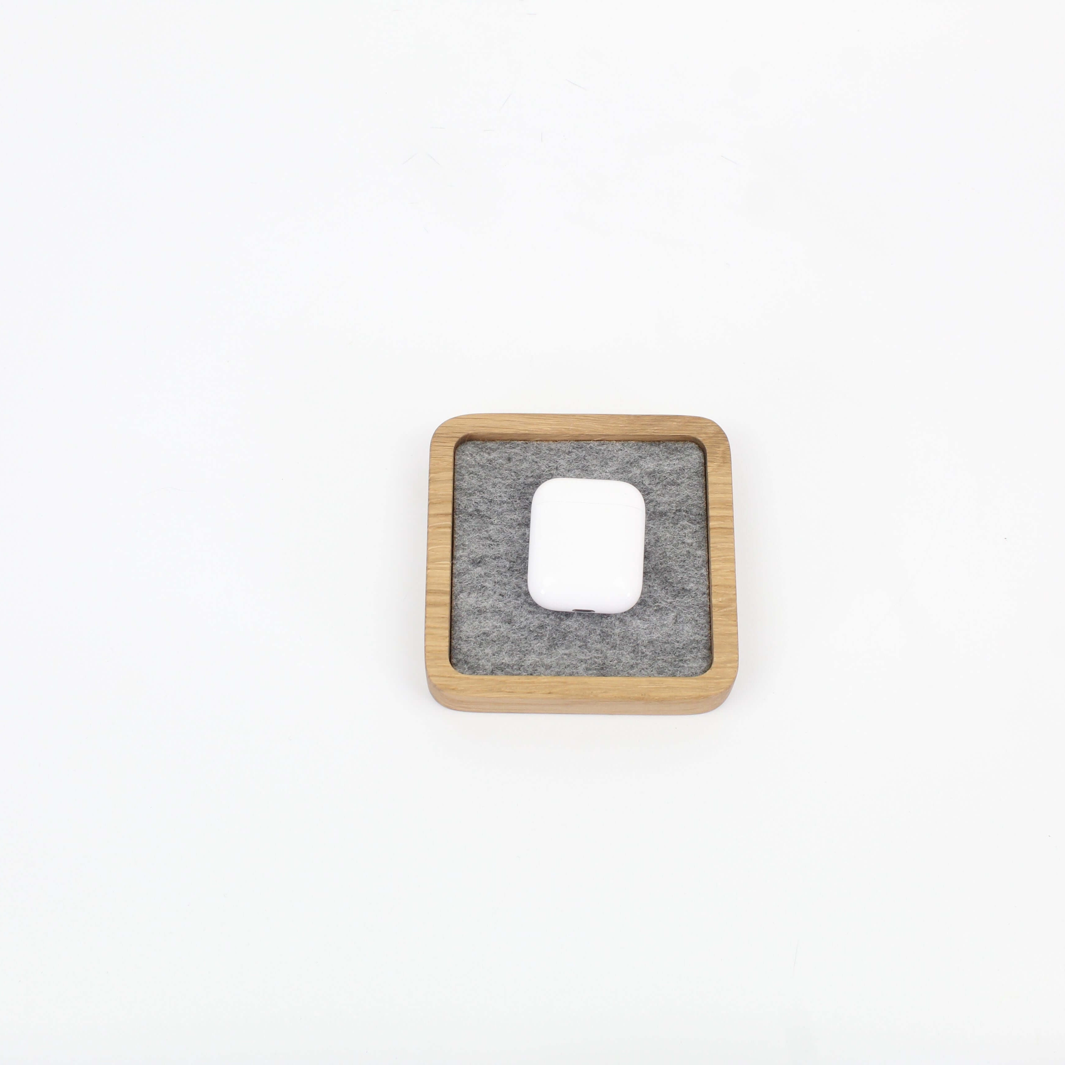 Small oak desk tray featuring a felt insert, perfect for organizing accessories and keeping your workspace tidy.
