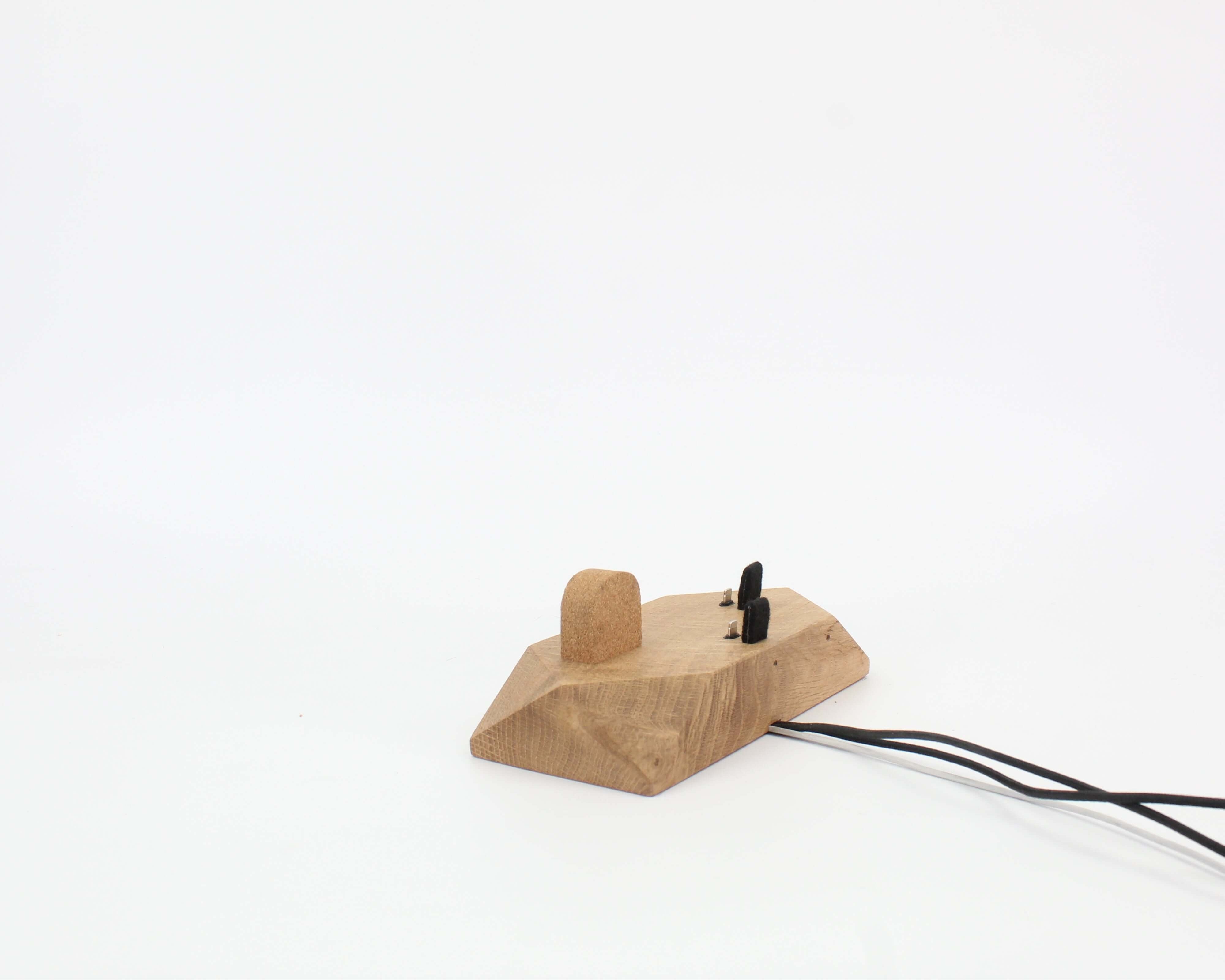 Triple Phone Dock - Oak for organizing smartphones and Apple Watch on a stylish desk setup.