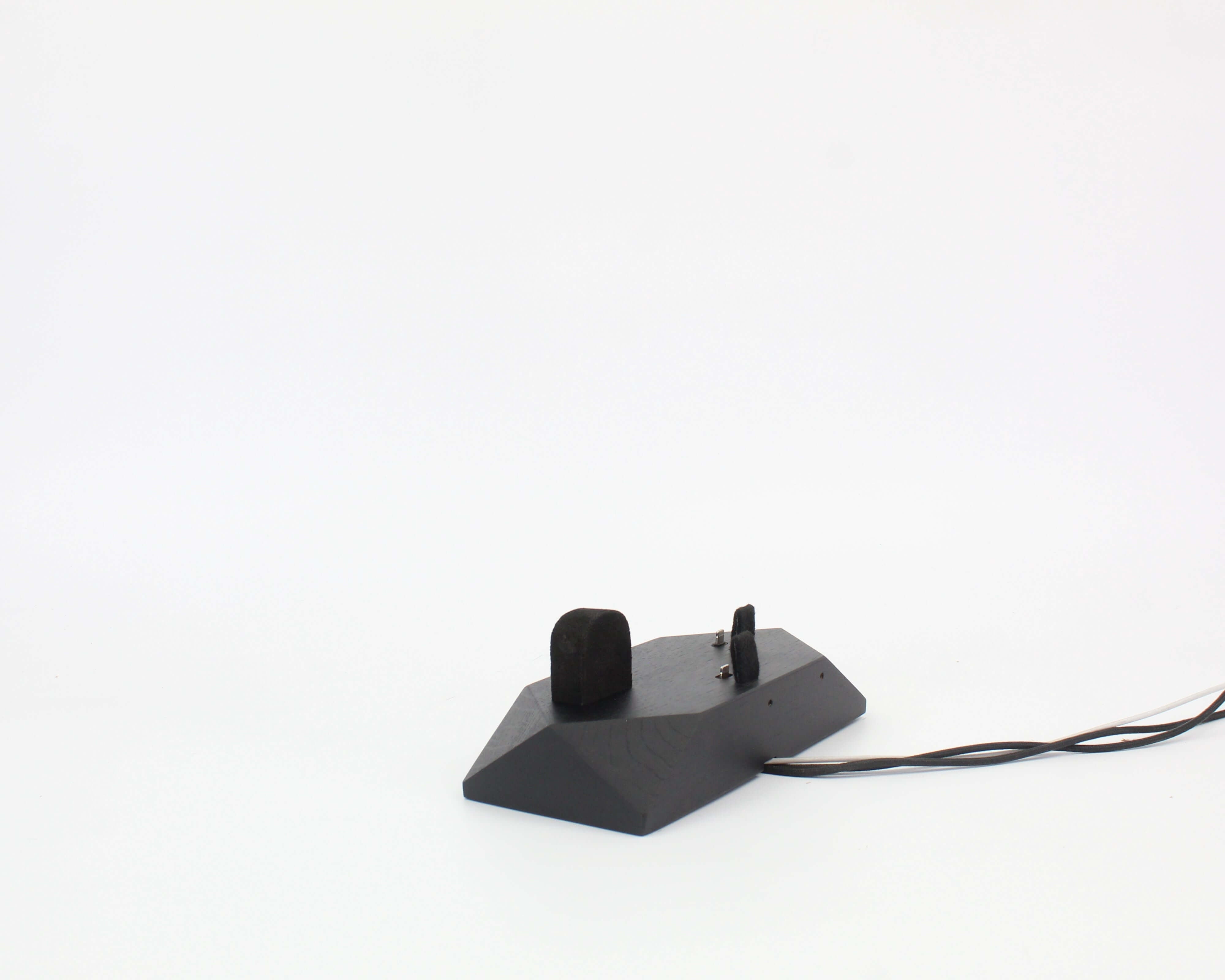 Black Oak Triple Phone Dock showcasing sleek design for smartphones and Apple Watch.