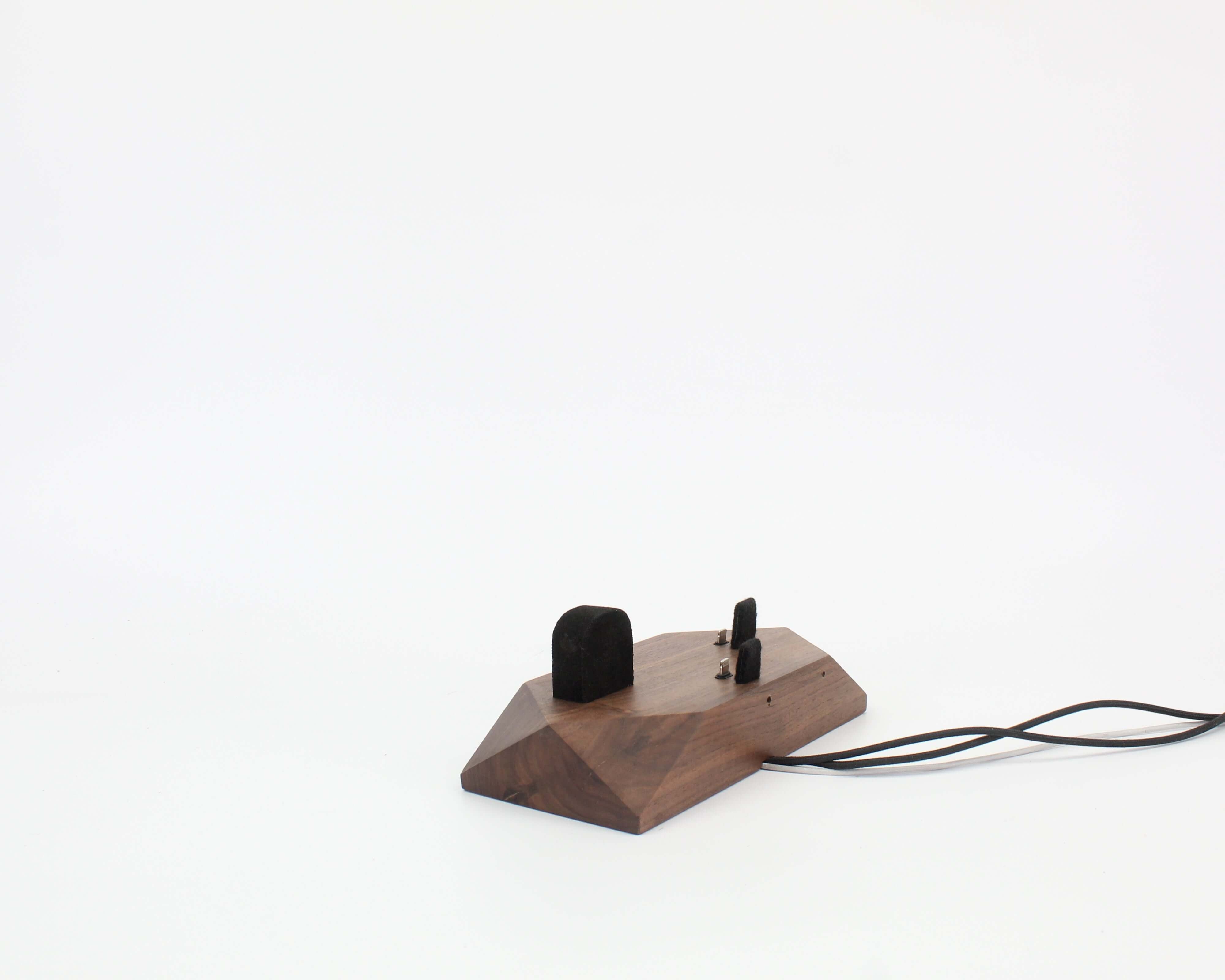 Triple Phone Dock in walnut design, accommodating two smartphones and an Apple Watch for workspace organization.