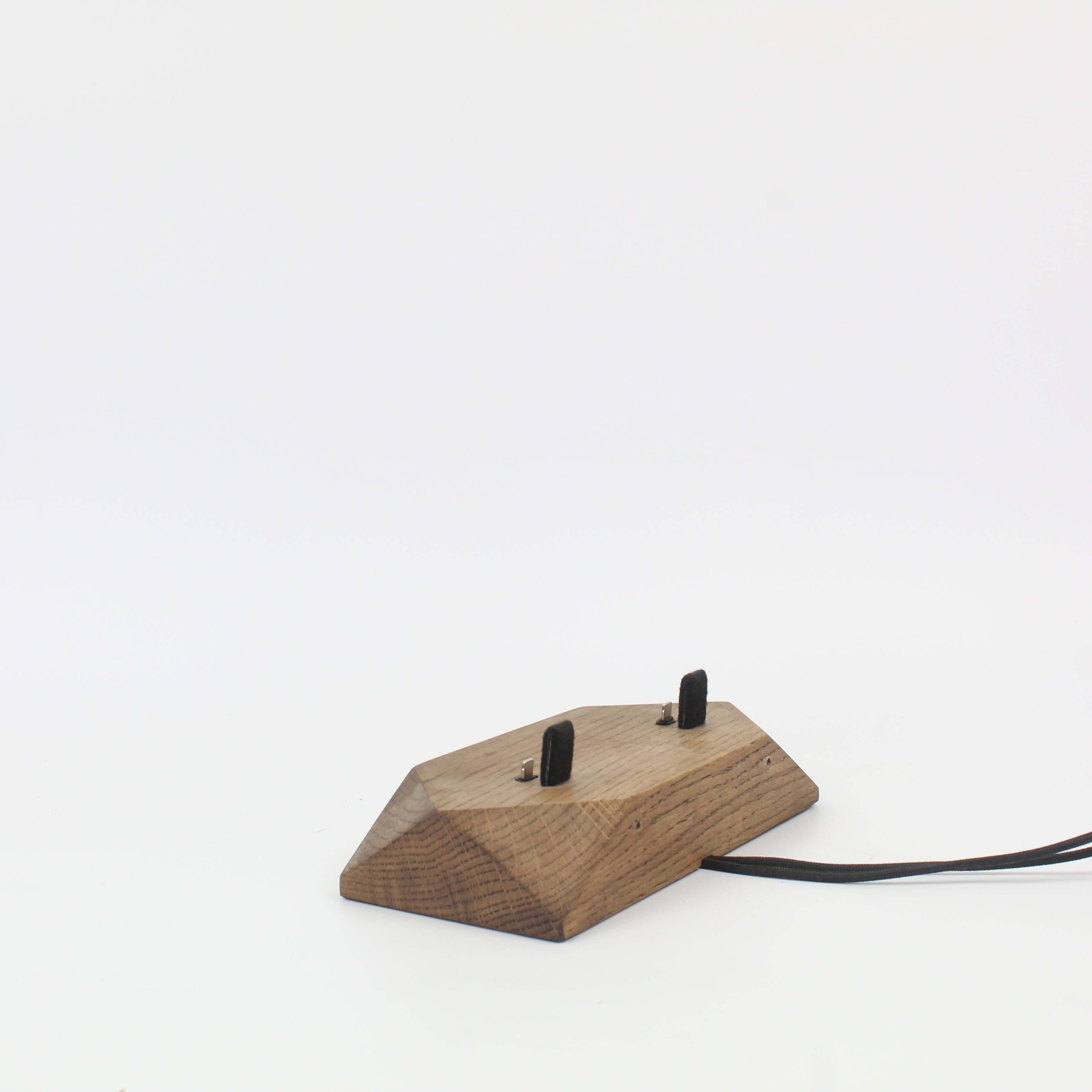 Dual Phone Dock in Brown Oak for simultaneous charging of devices, reducing cable clutter and enhancing desk organization.