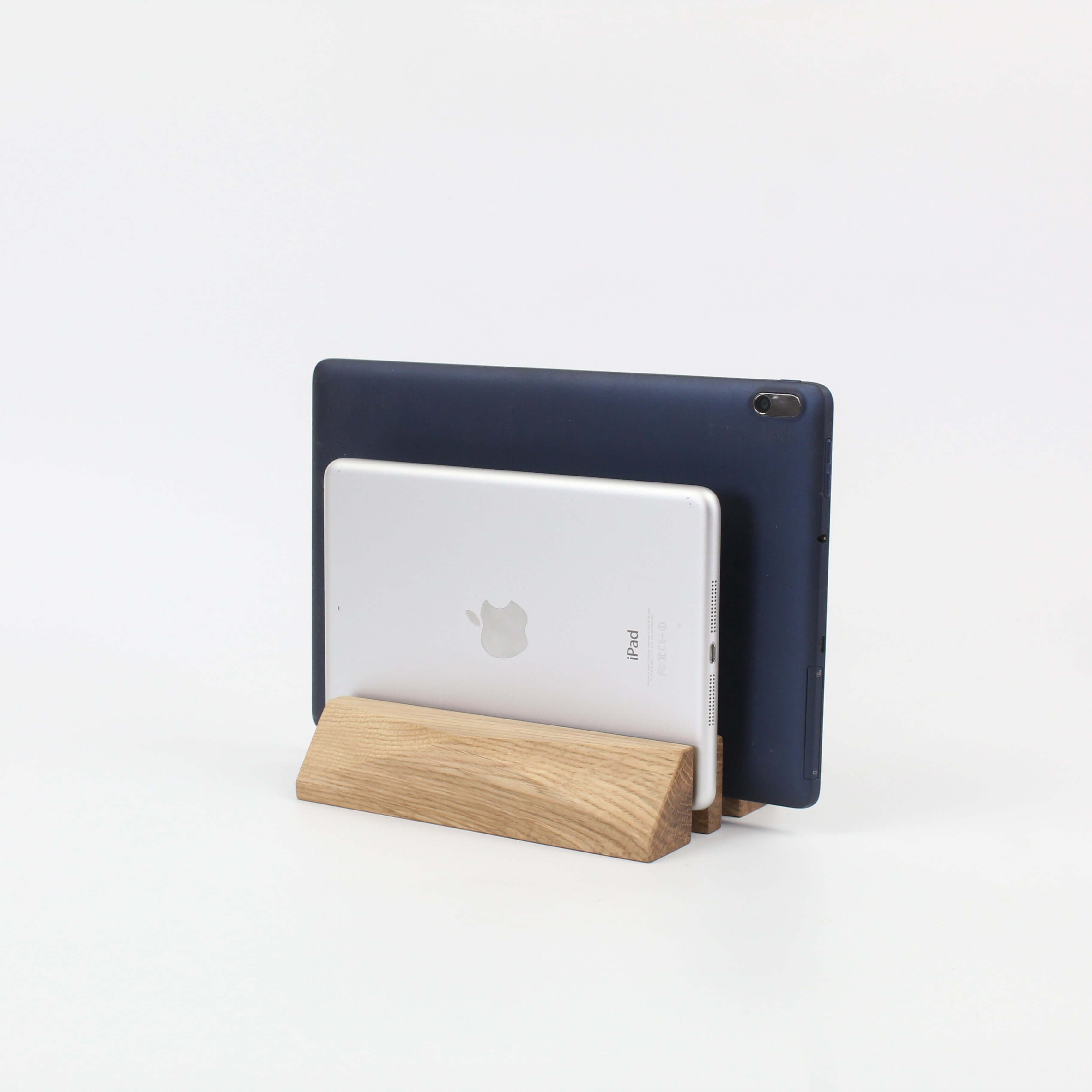 Dual laptop stand in oak showcasing a sleek design holding two devices, ideal for desk organization and laptop accessories.