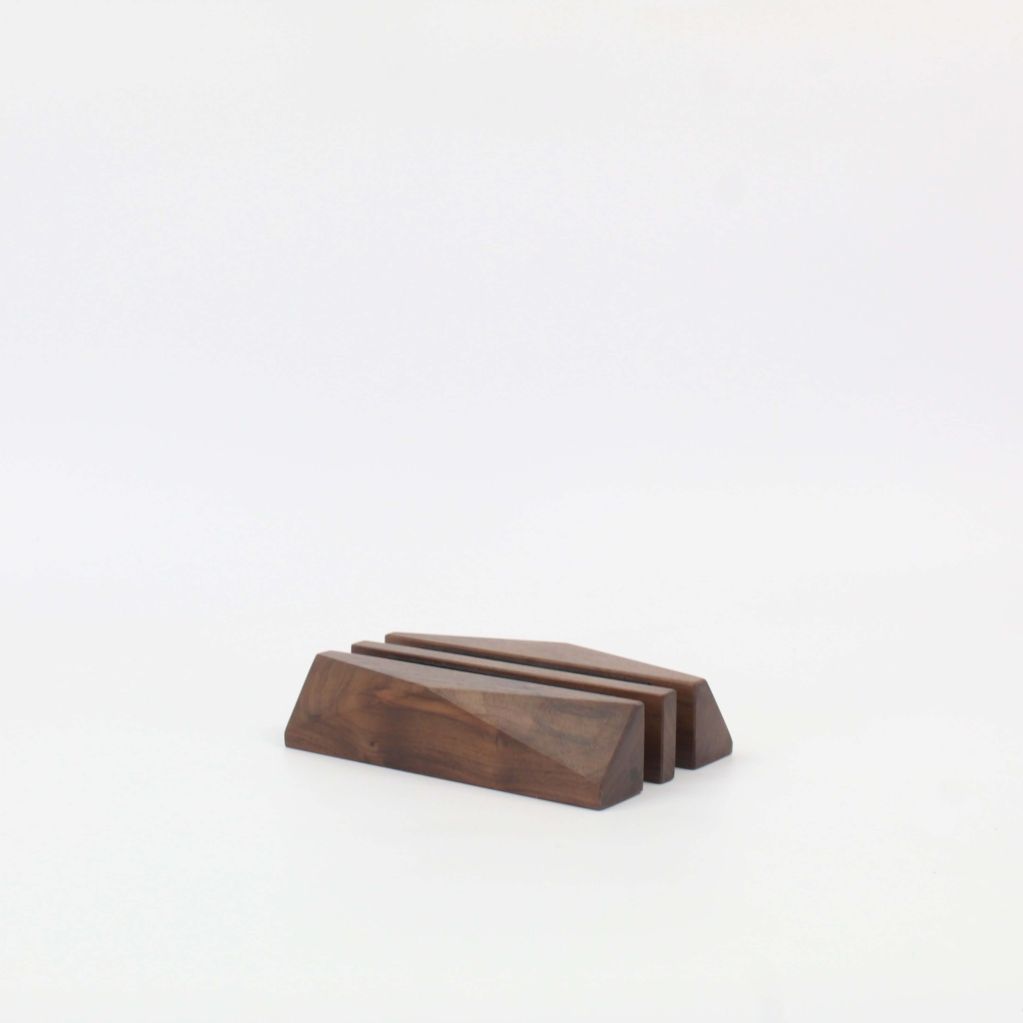 Dual walnut laptop stand designed for stylish desk organization and efficient storage of up to two devices.