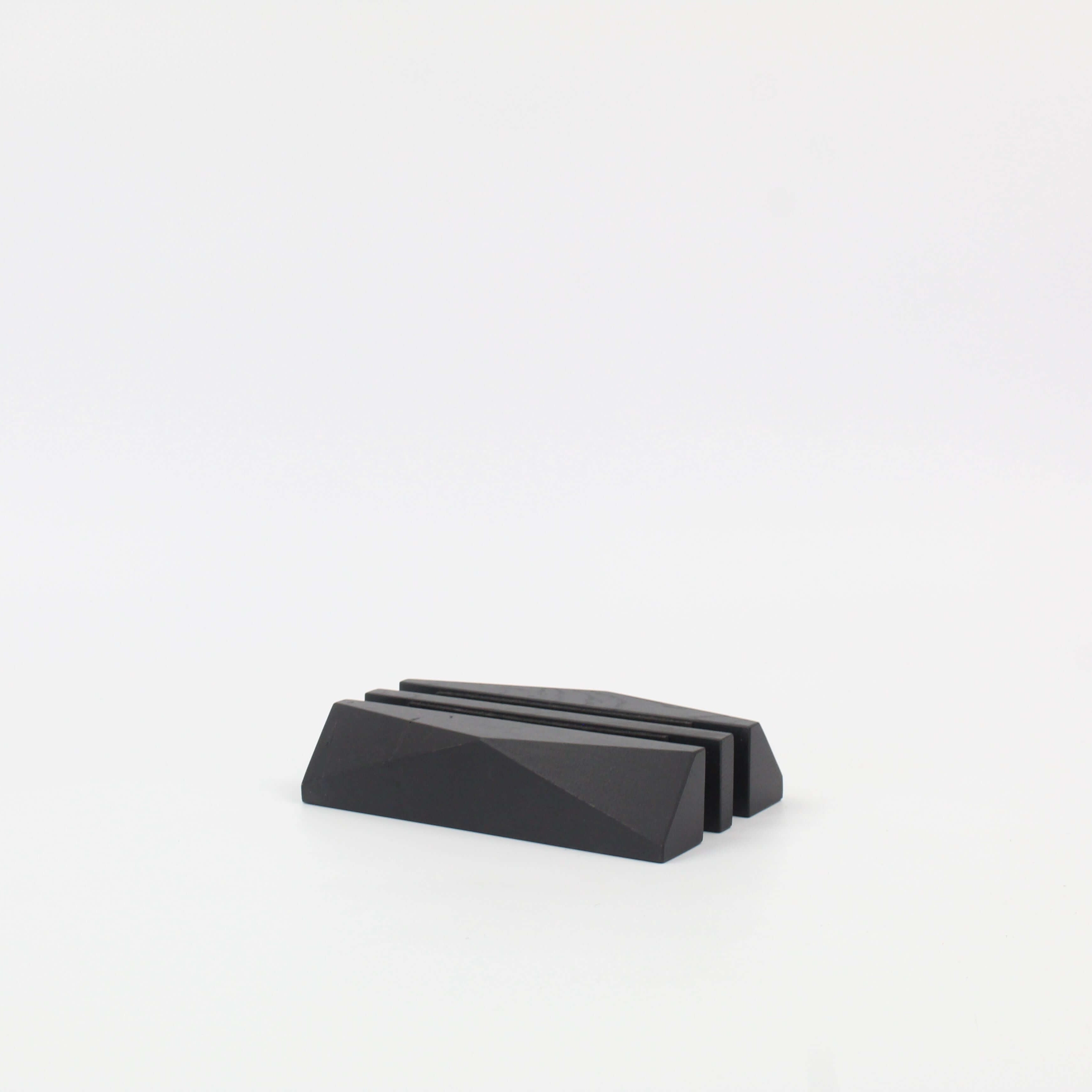 Dual laptop stand in stained black oak, designed as a sleek desk organizer for workspace efficiency.