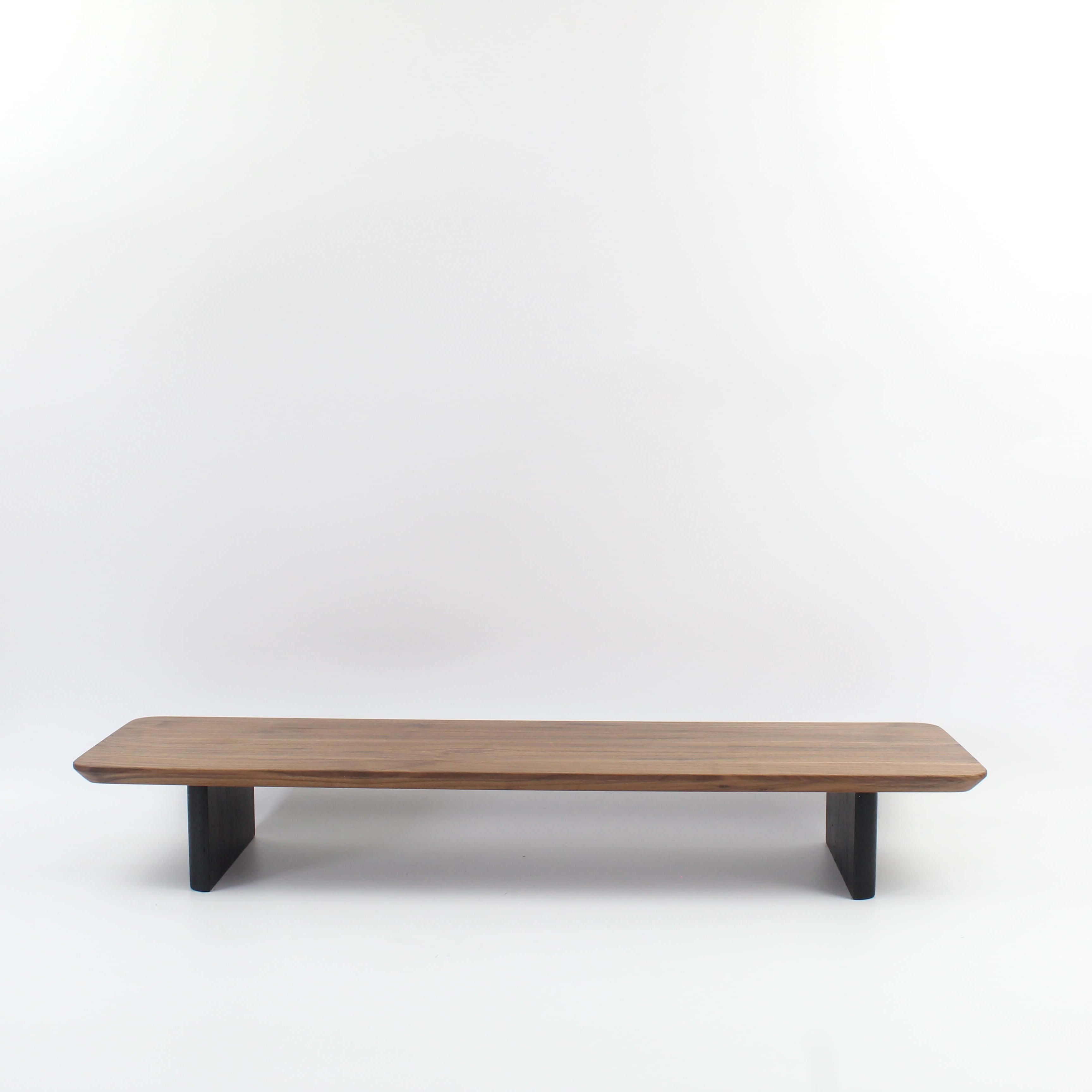 Walnut desk shelf showcasing a sleek design, ideal for workspace organization and as a wood monitor riser.