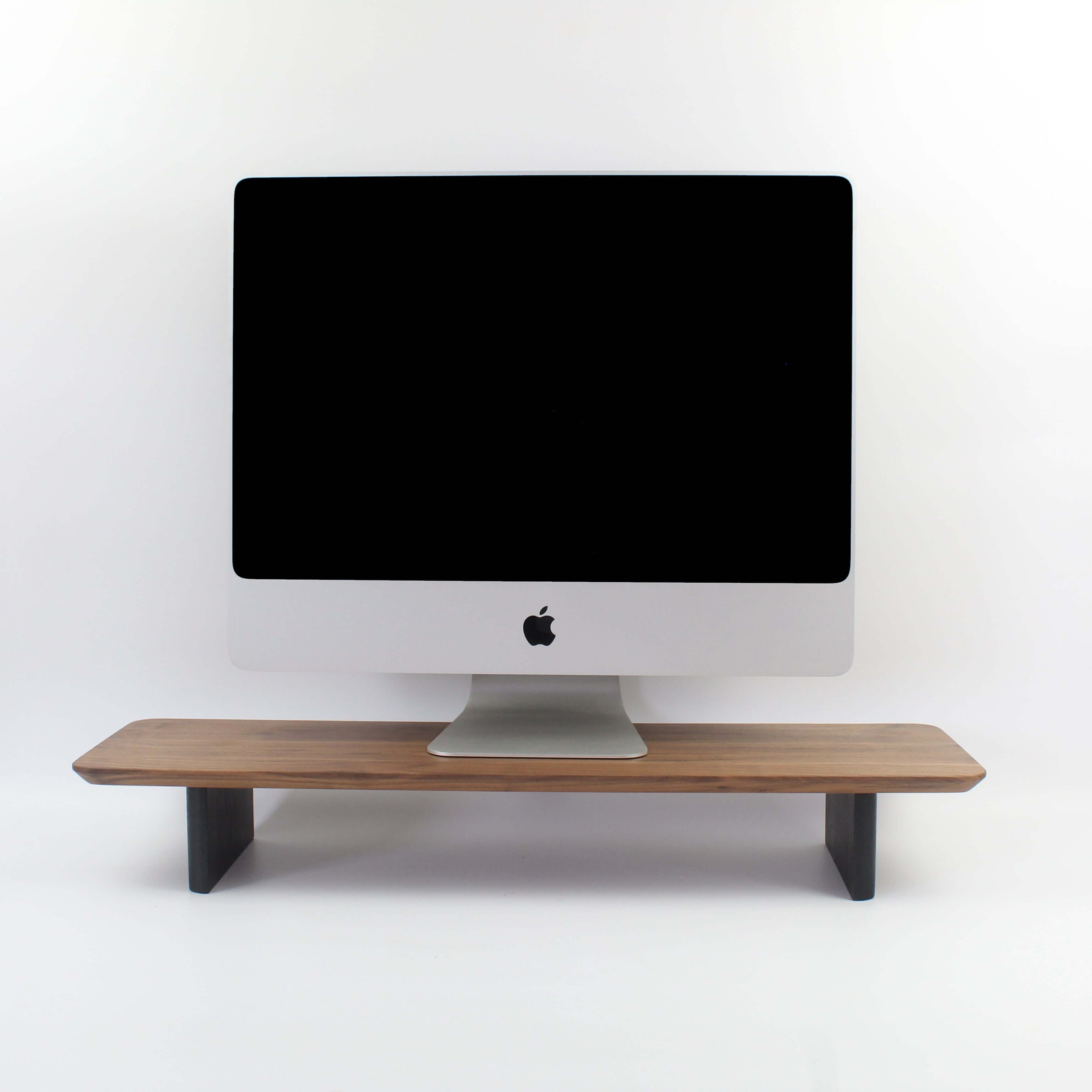 Walnut desk shelf monitor riser enhancing workspace organization and aesthetics.
