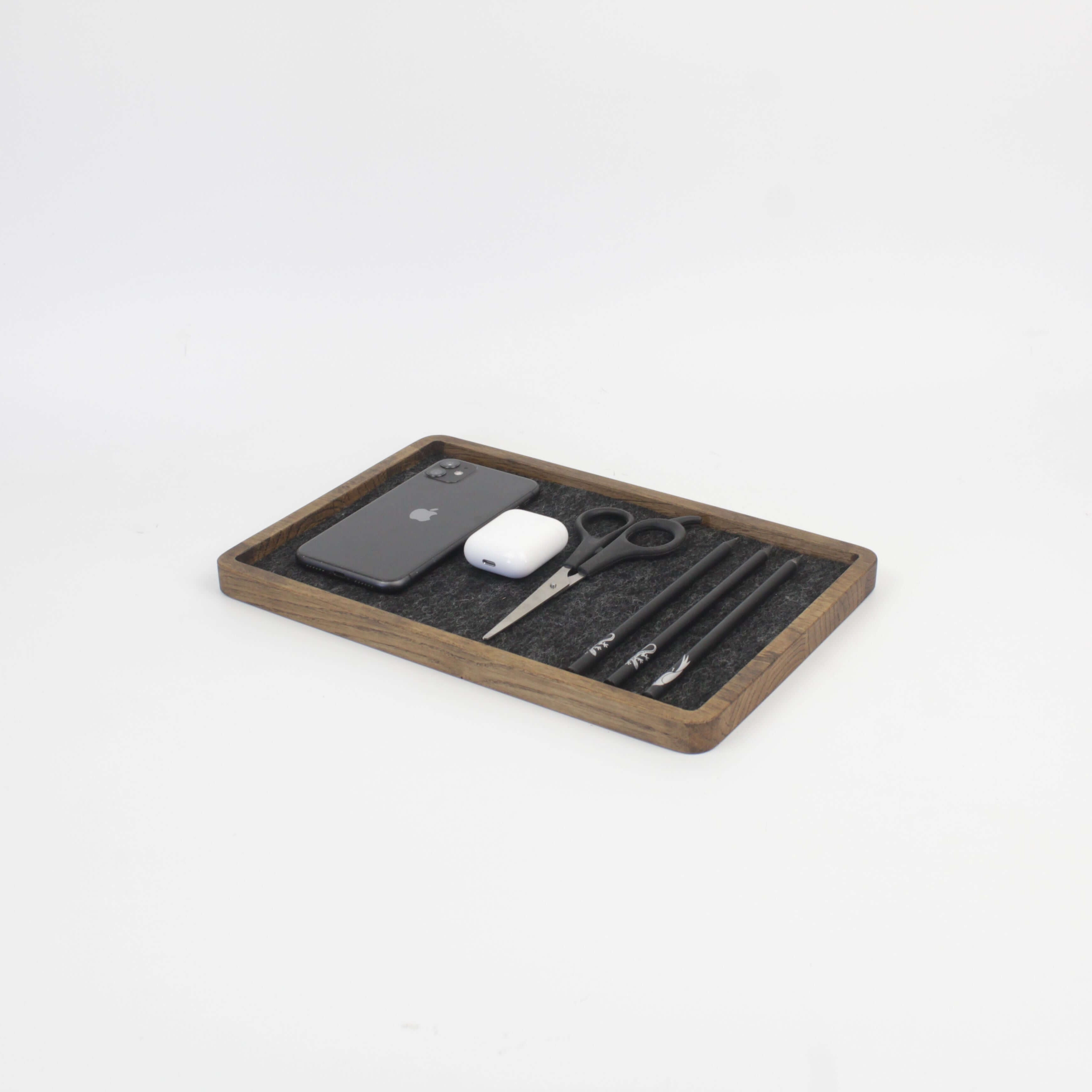 Catch All Tray in brown oak holding a phone, AirPods, scissors, and pens for organized living.