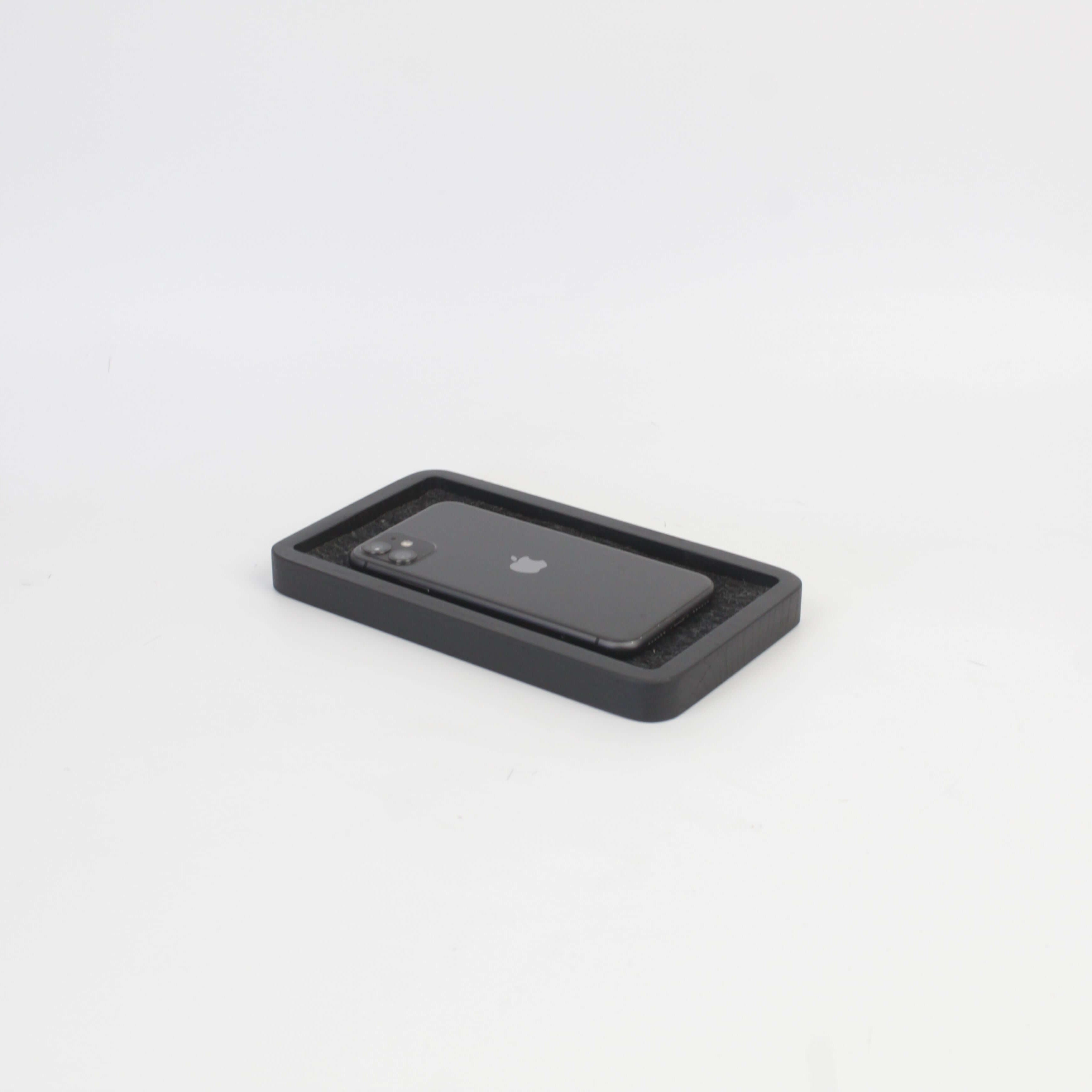 Catch All Tray in black oak with smartphone, perfect for organization and style on desk or nightstand.
