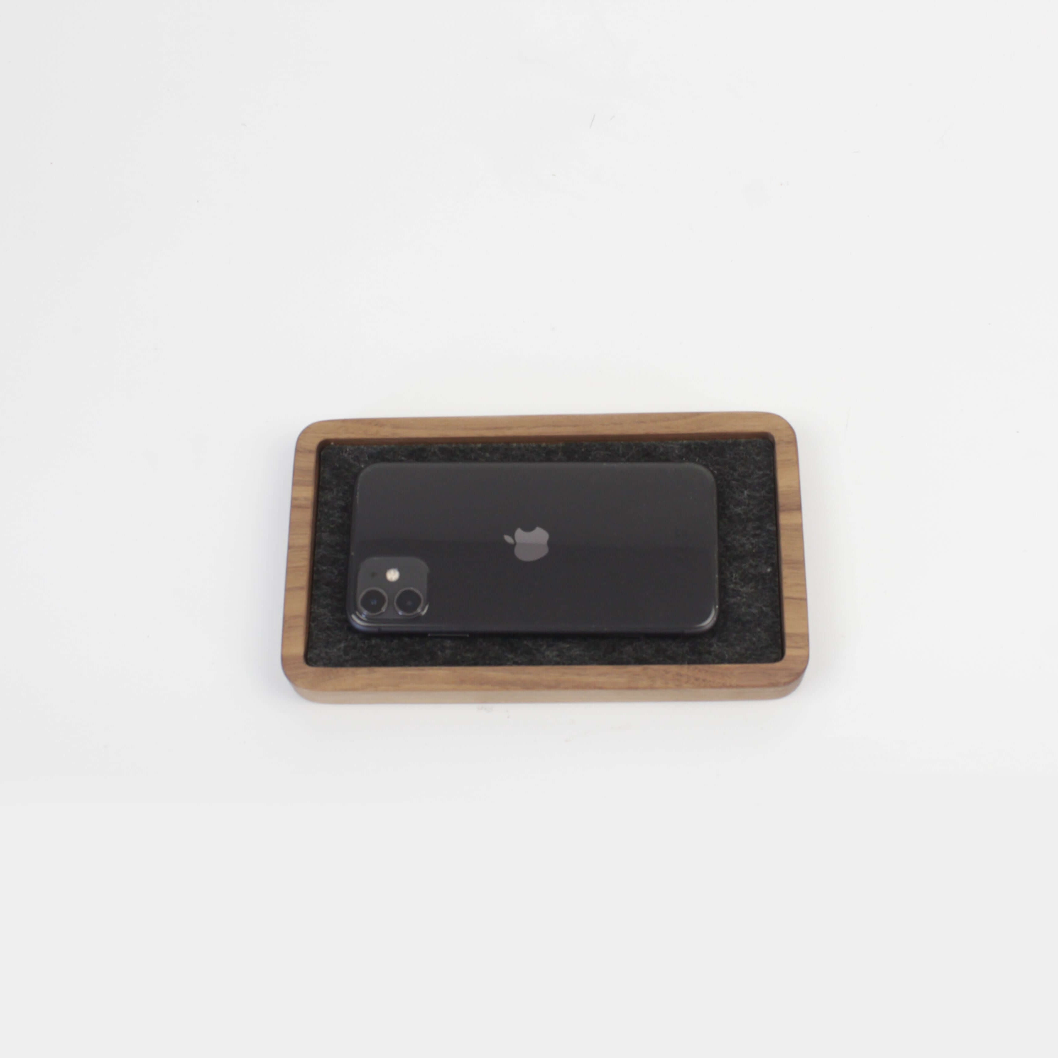 Catch All Tray in Walnut with black phone, perfect desk tray for organizing EDC items and maintaining a tidy space.