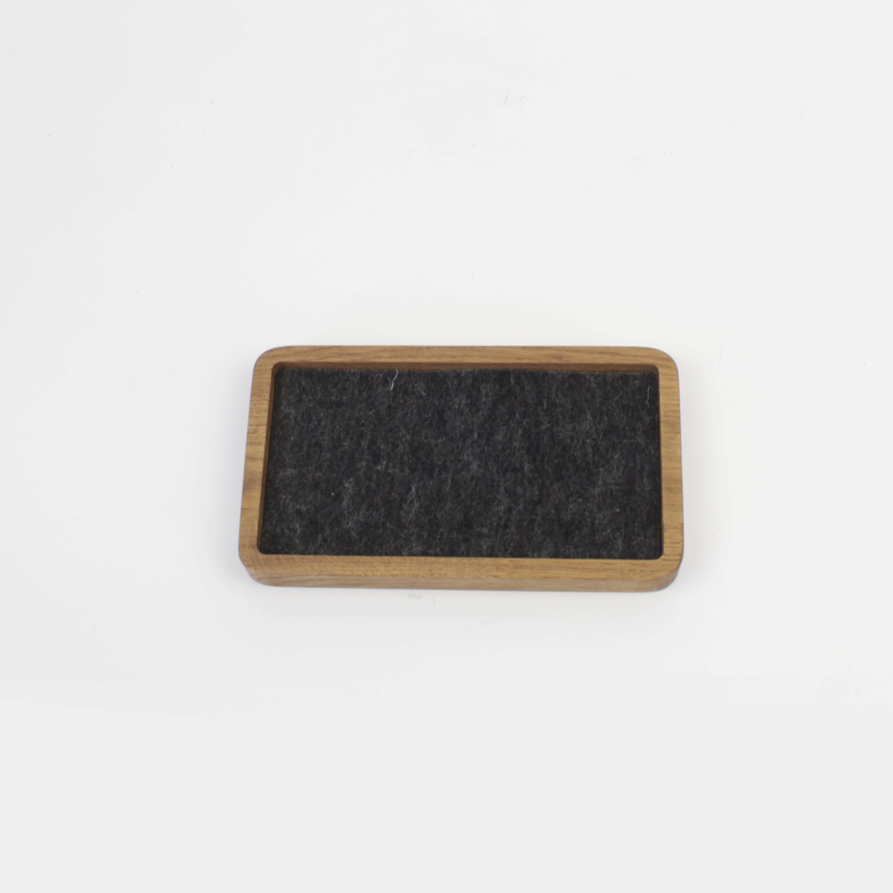 Brown oak desk tray with black felt surface, ideal for phone, wallet, and accessories organization.
