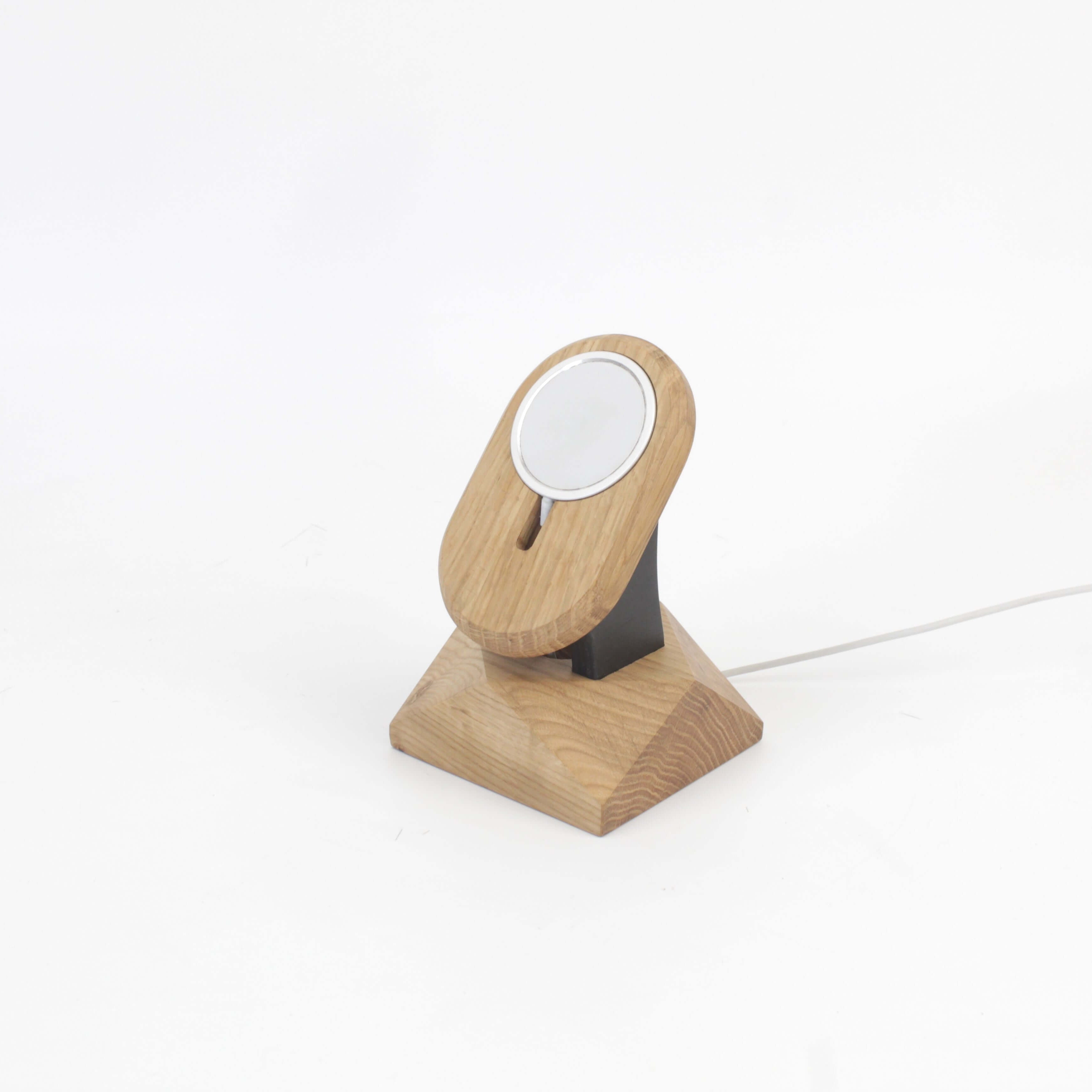 Handcrafted oak MagSafe iPhone stand serving as a stylish iPhone wireless charger and accessory.