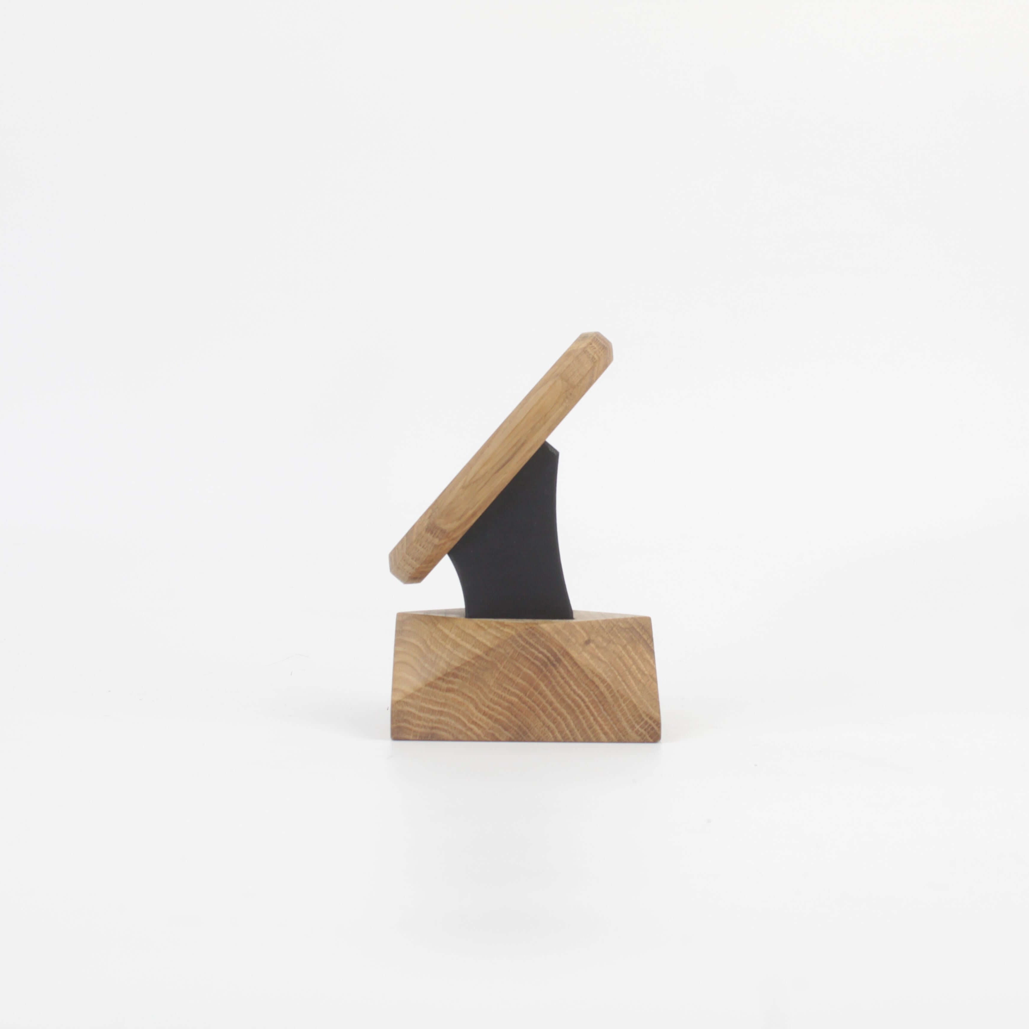 Handcrafted oak MagSafe iPhone stand, showcasing minimalist design for an elegant wireless charging solution.