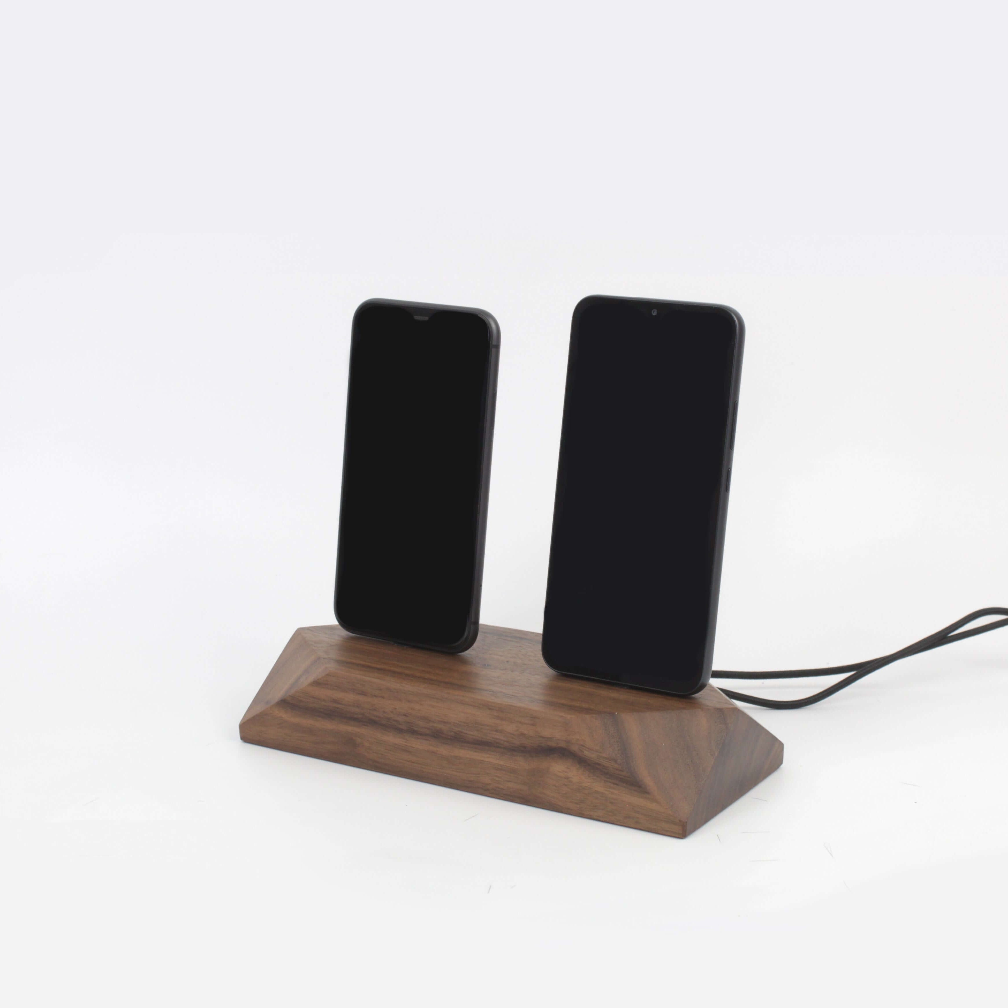 Dual phone dock in walnut finish charging two devices simultaneously, promoting a clutter-free workspace.