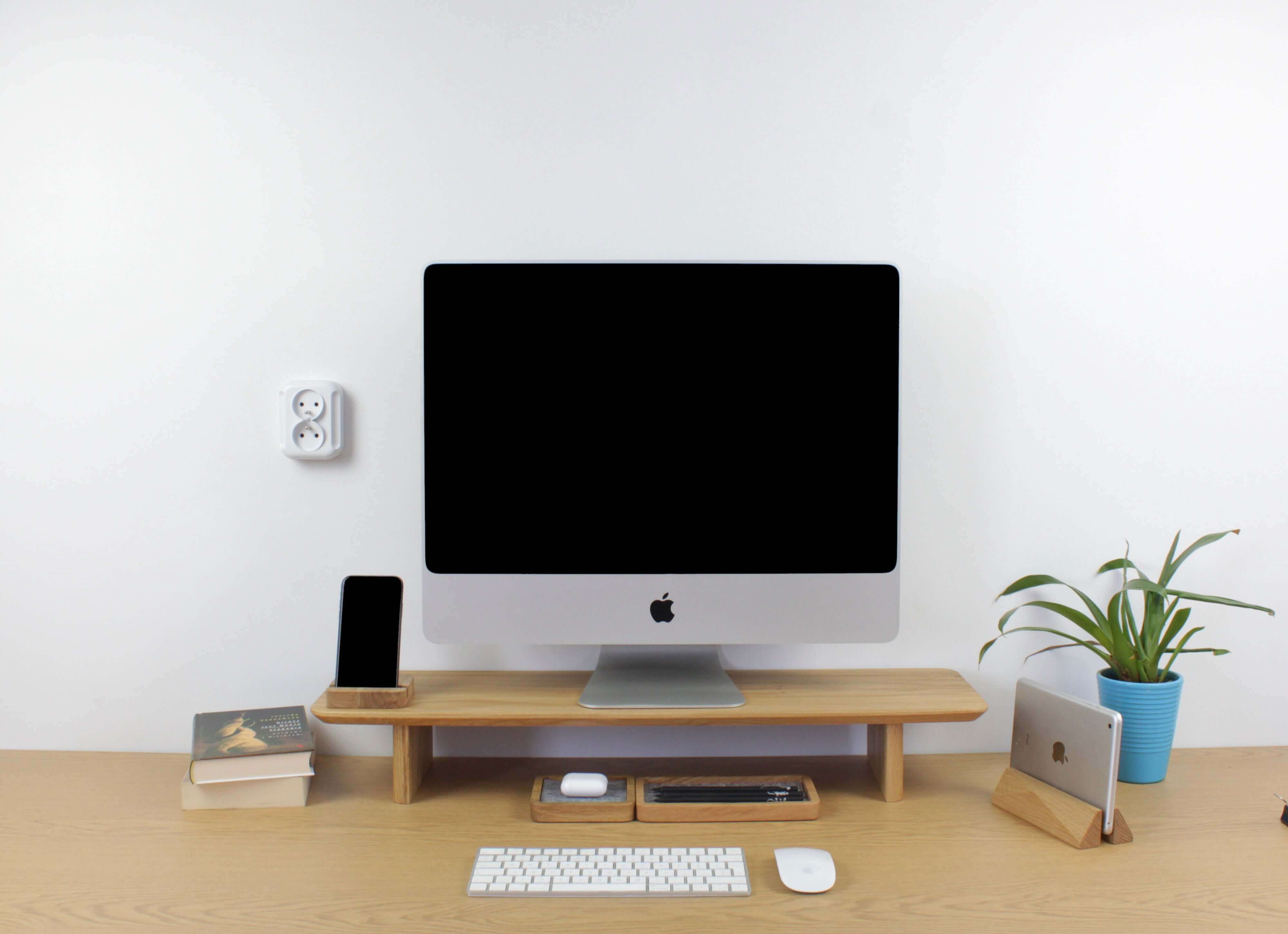 Desk Shelf - Oak providing organization and storage for a modern workspace with a computer and accessories.