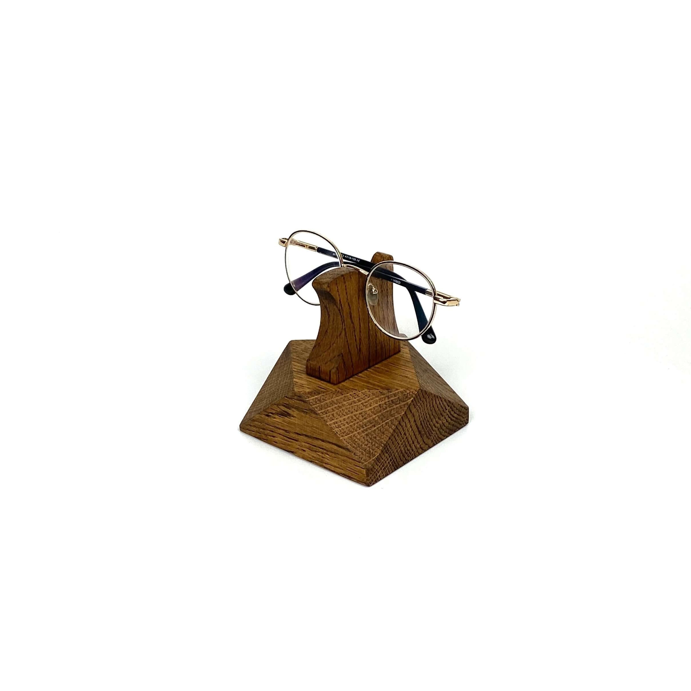 Eyeglasses Stand made from brown oak wood, elegantly displaying glasses on a desk or nightstand.