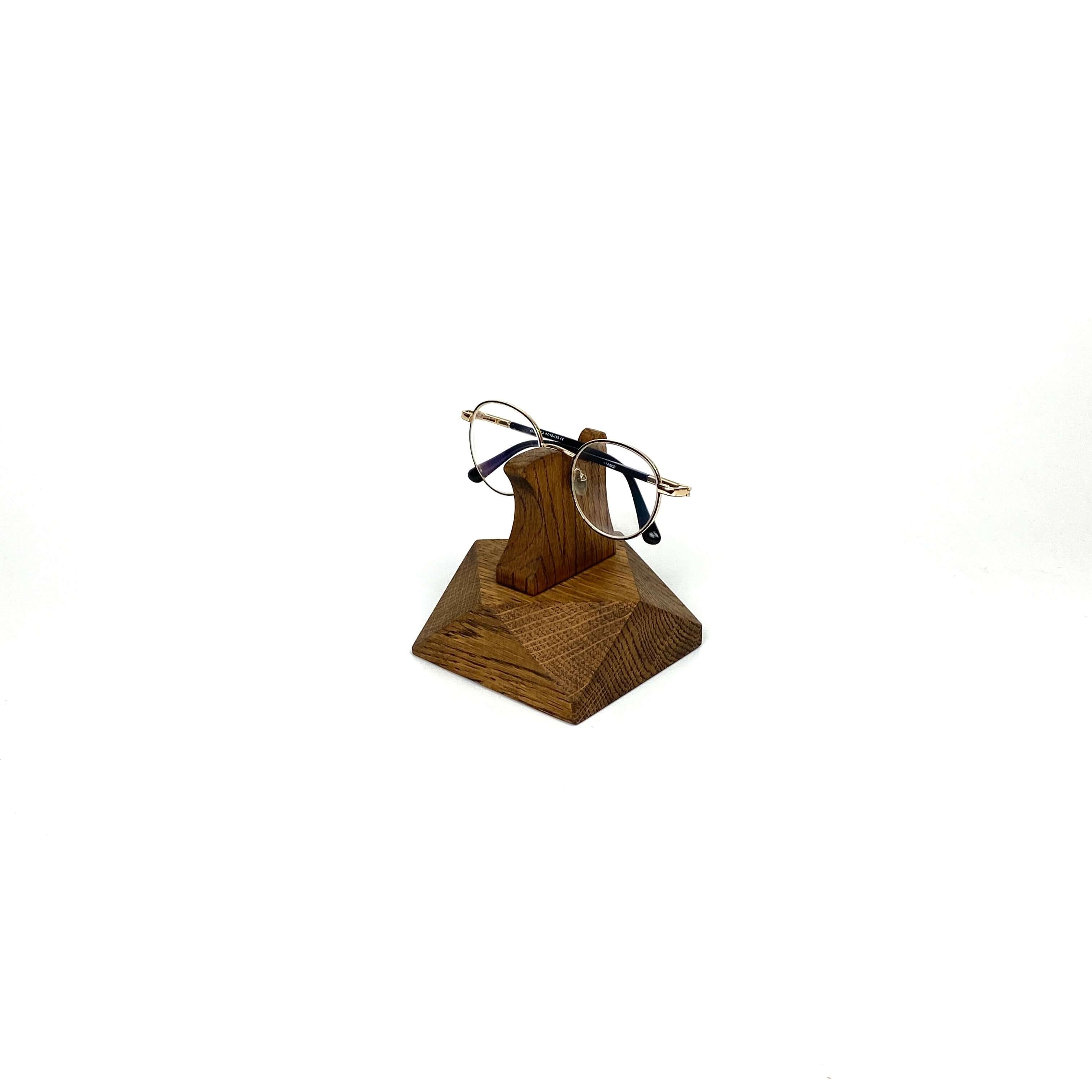 Eyeglasses Stand made from brown oak wood, elegantly displaying glasses on a desk or nightstand.