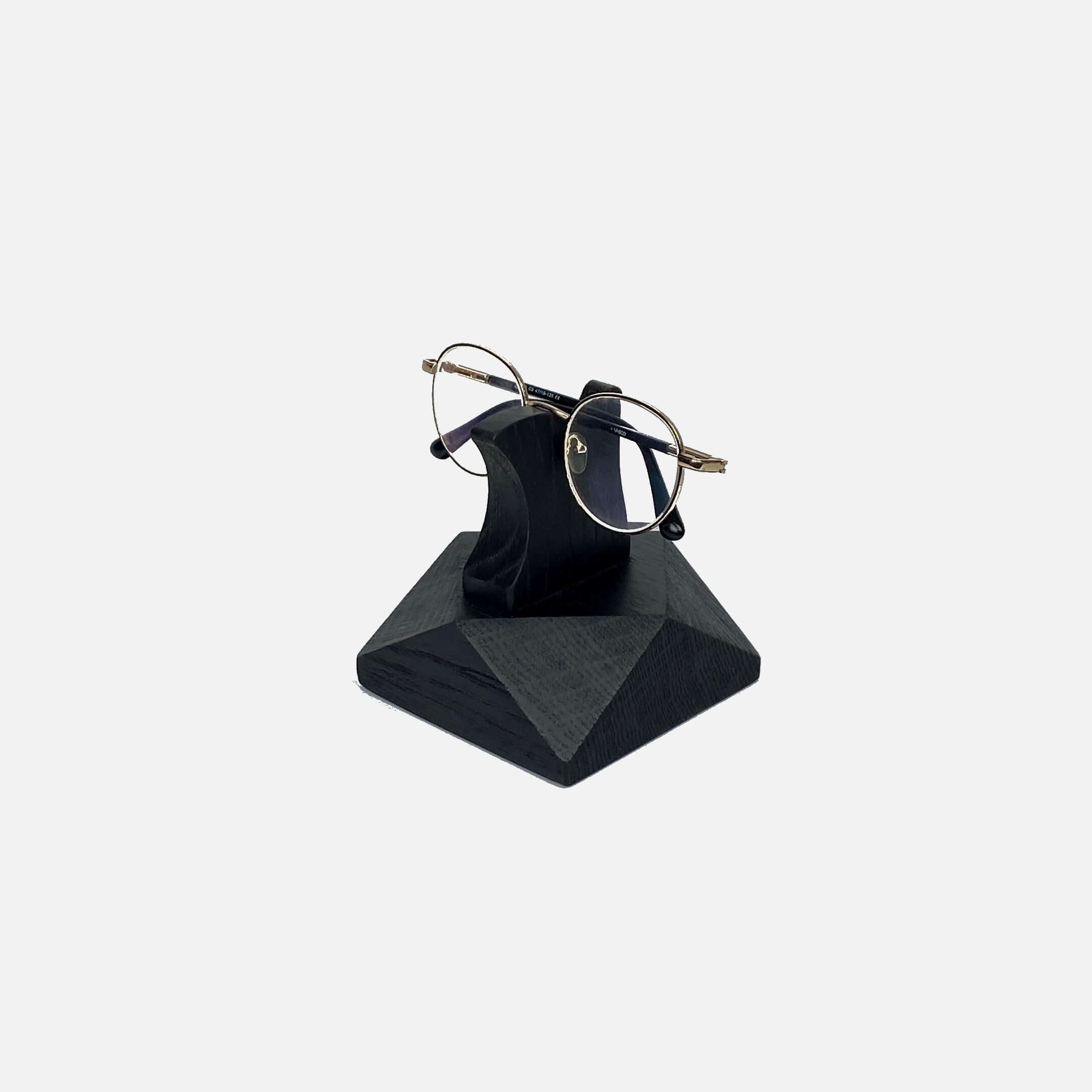 Wooden Eyeglasses Stand holding glasses, handcrafted from black oak, stylish and functional for home or office.