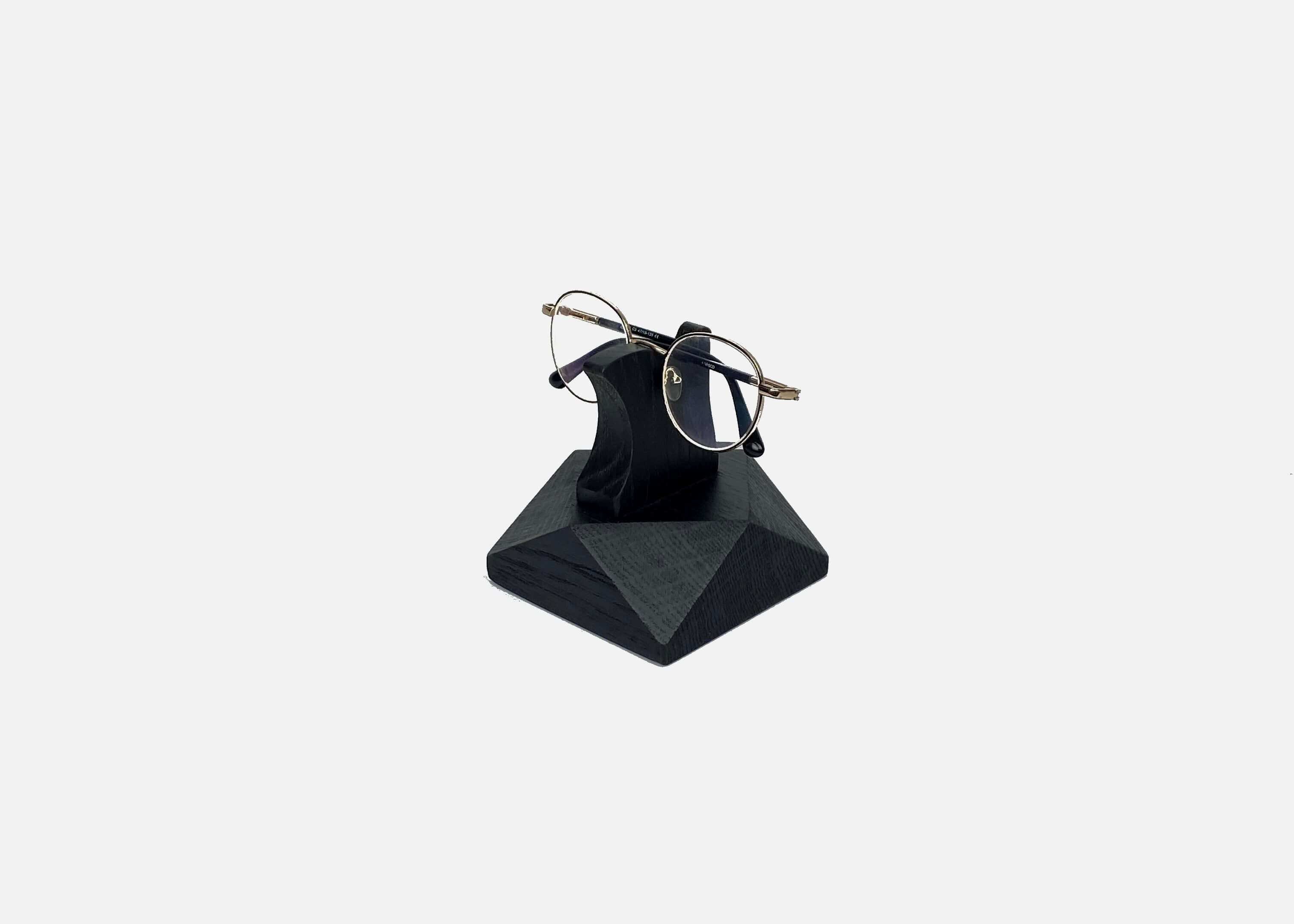 Wooden Eyeglasses Stand holding glasses, handcrafted from black oak, stylish and functional for home or office.