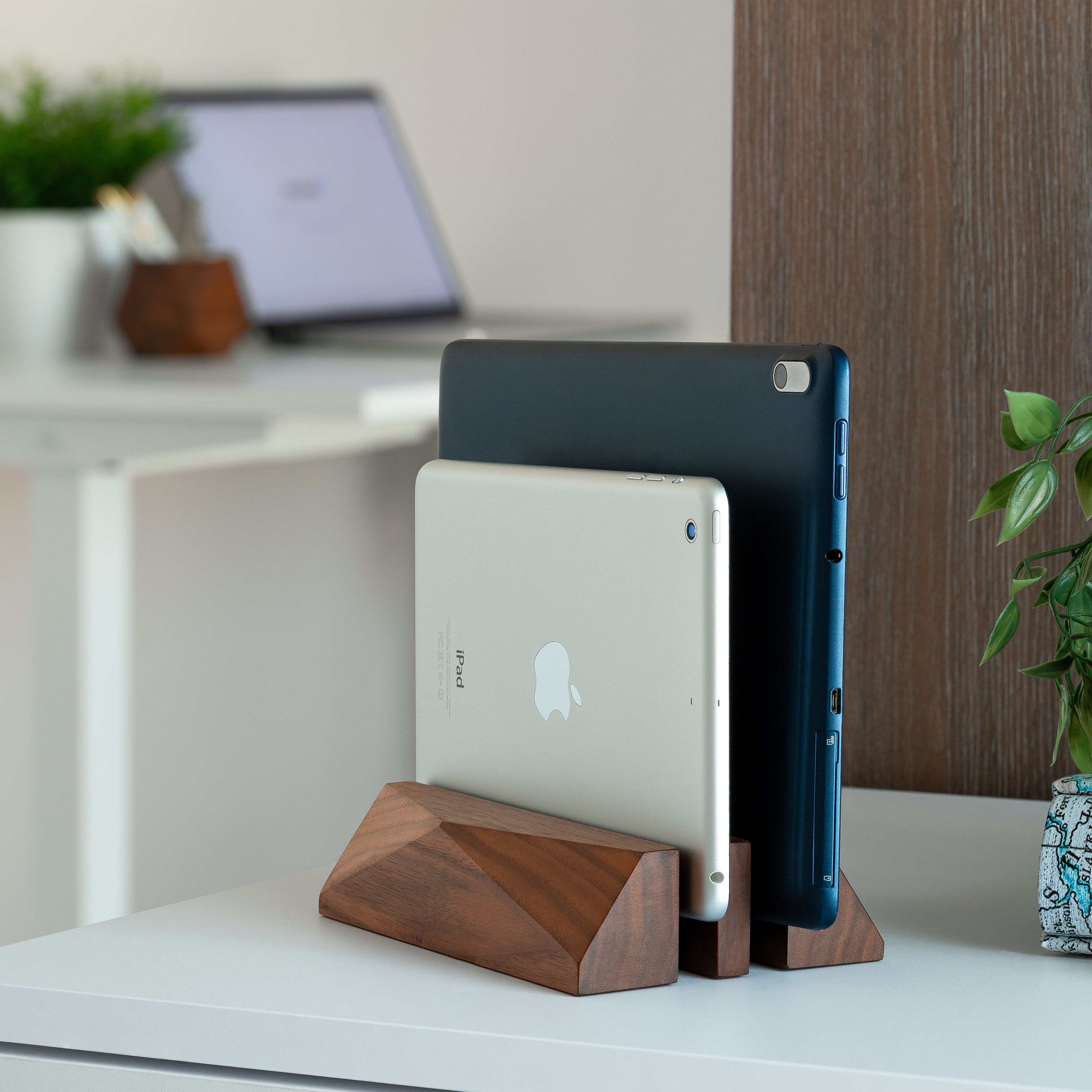 Dual Laptop Dock - Walnut holding two devices in a stylish workspace, showcasing minimalist design and organization.