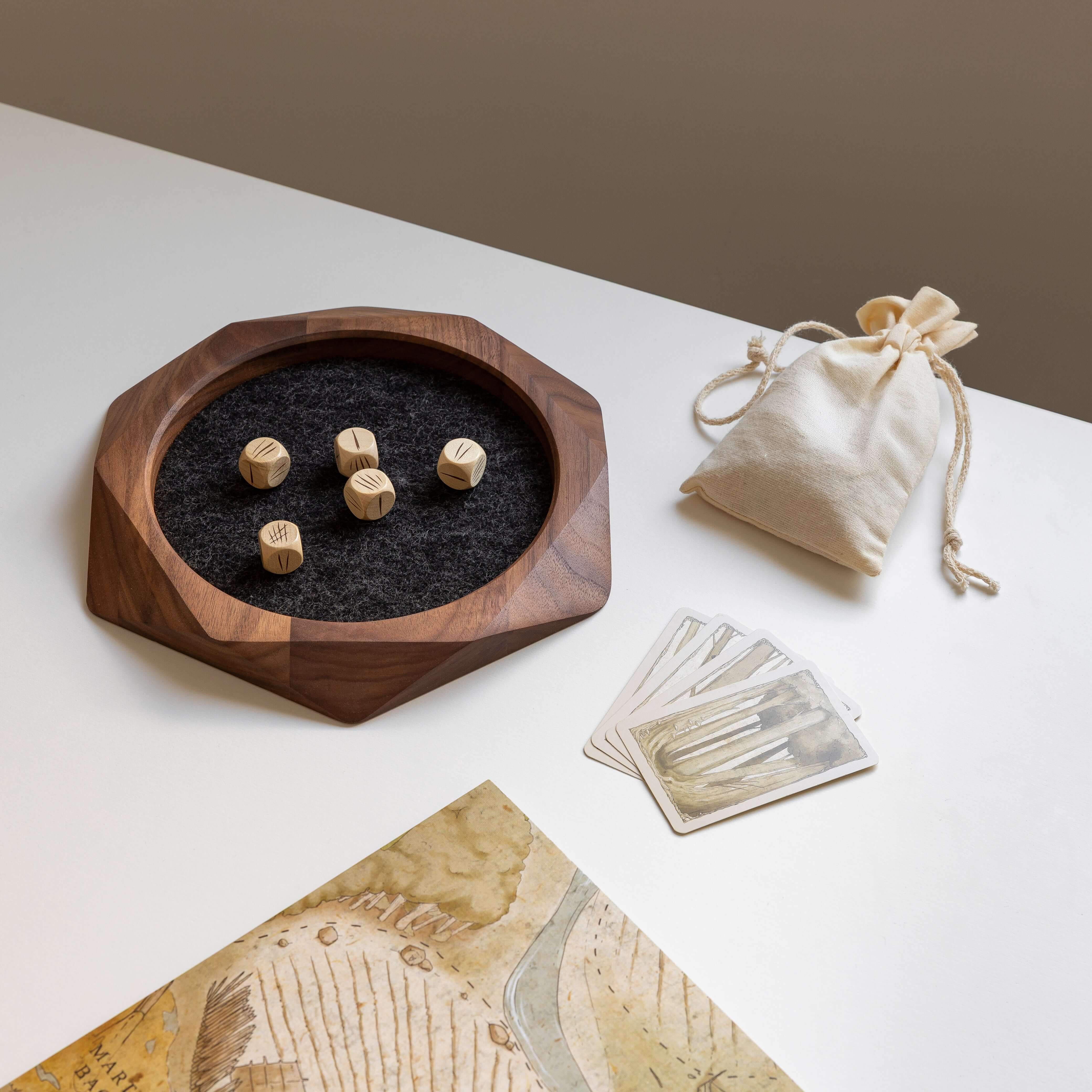 Geometric Wooden Tray - Black Oak with felt lining, dice and cards on a table for organized tabletop gaming.