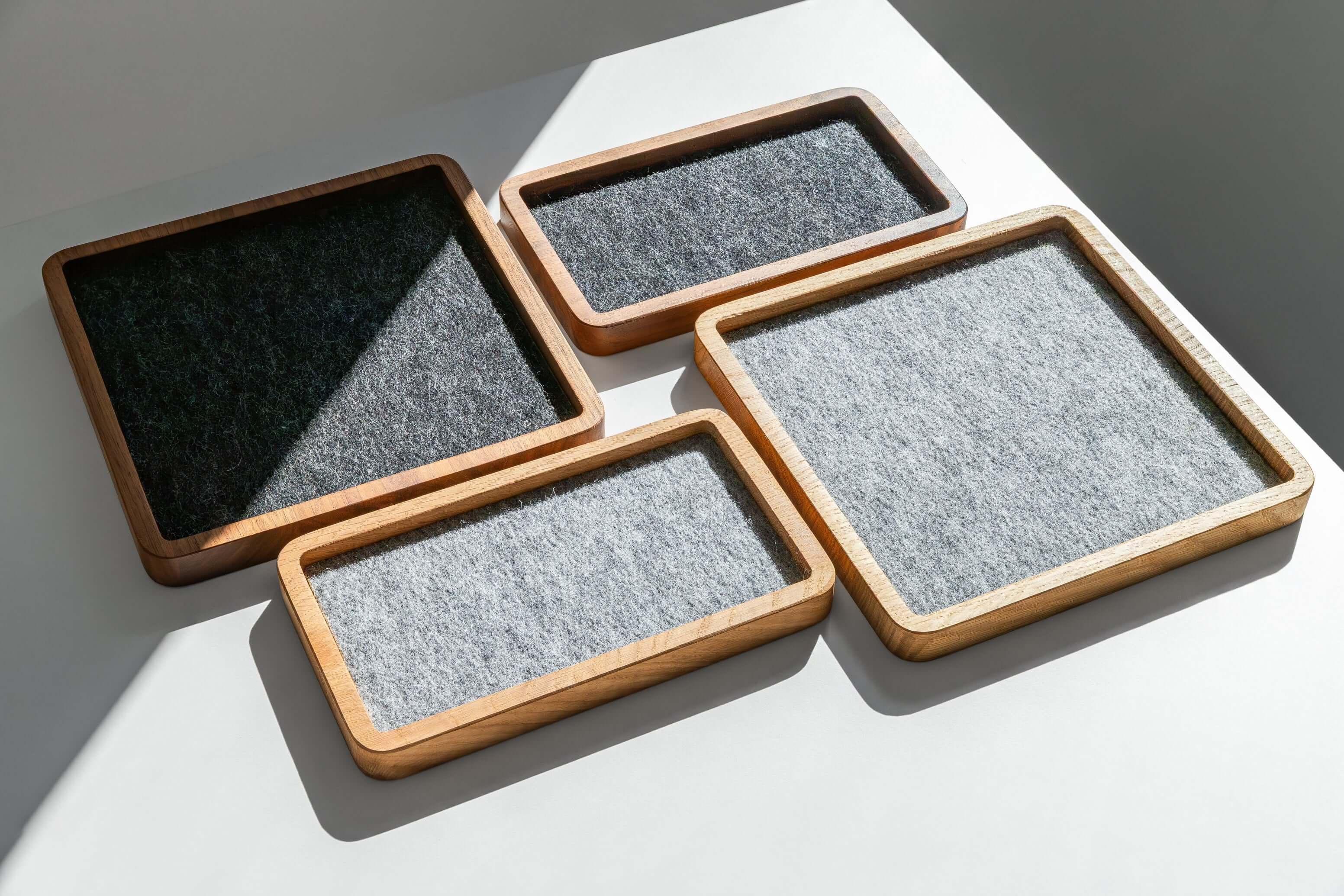 Catch All Tray - Walnut - Square, set of four stylish organizing trays on a light surface.