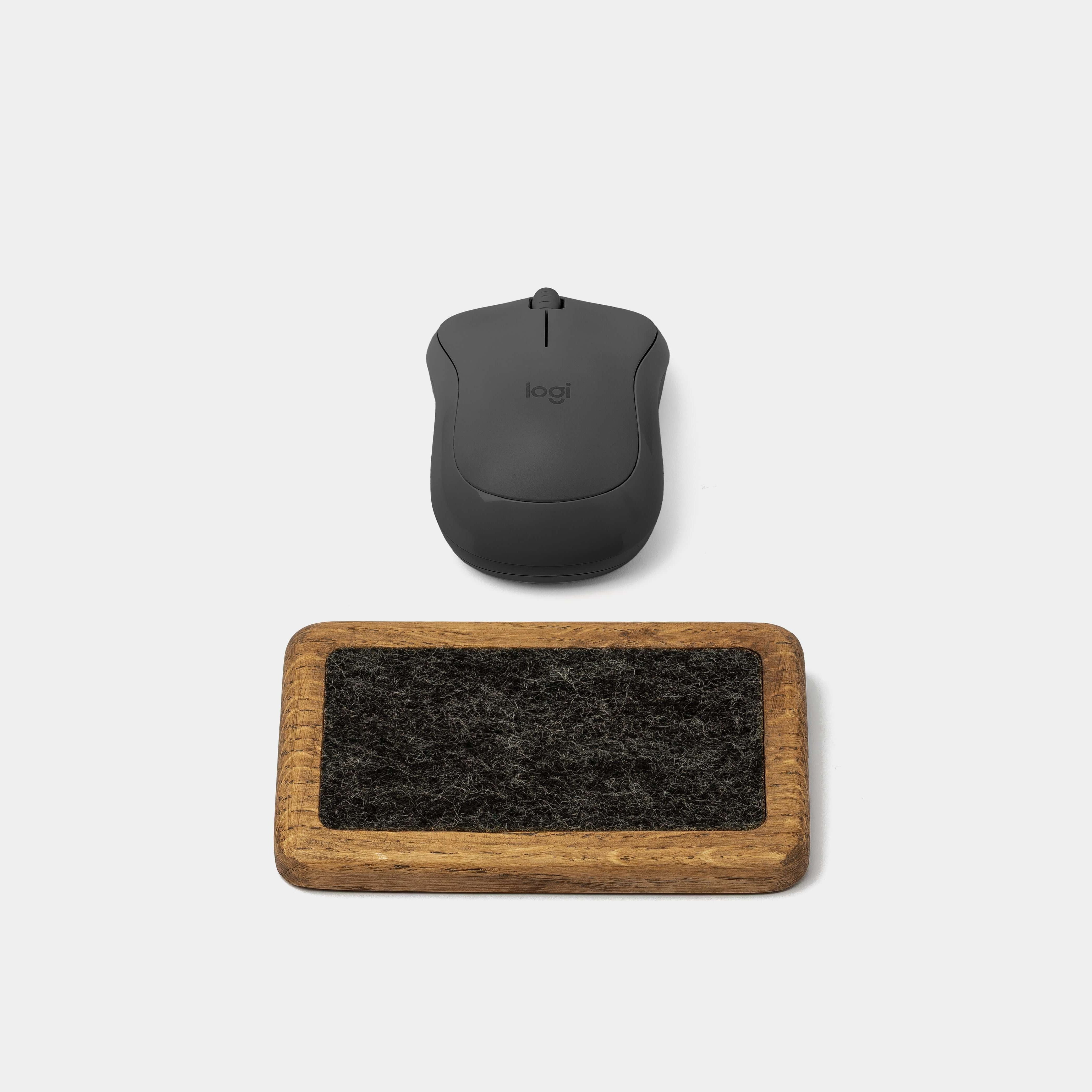 Mouse Wrist Rest - Brown Oak alongside a sleek black wireless mouse on a minimalist background.