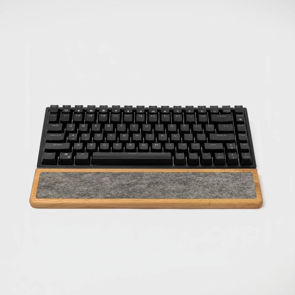 Keyboard Wrist Rest made of oak wood paired with a black mechanical keyboard for ergonomic typing support.