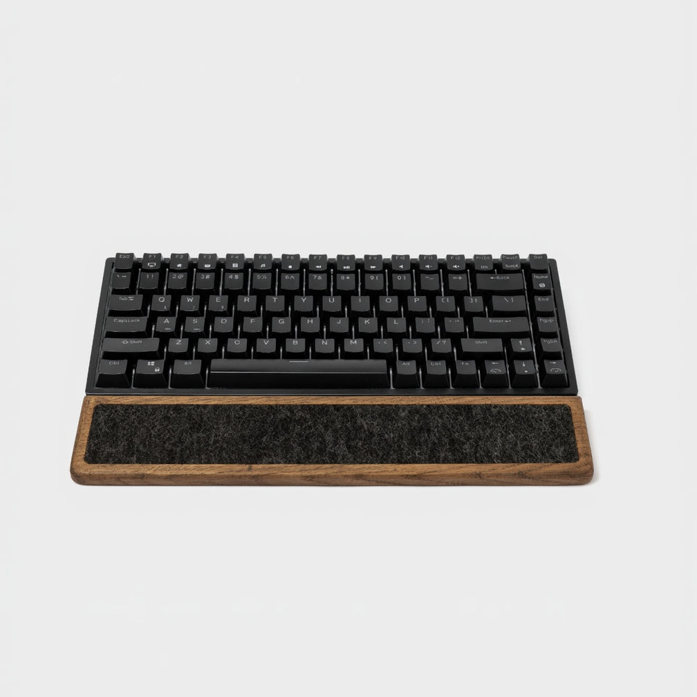 Keyboard Wrist Rest - Brown Oak positioned under a black mechanical keyboard, offering ergonomic support.
