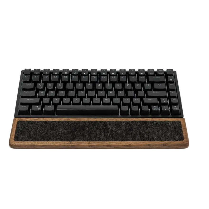 Keyboard Wrist Rest - Brown Oak positioned under a black mechanical keyboard, offering ergonomic support.