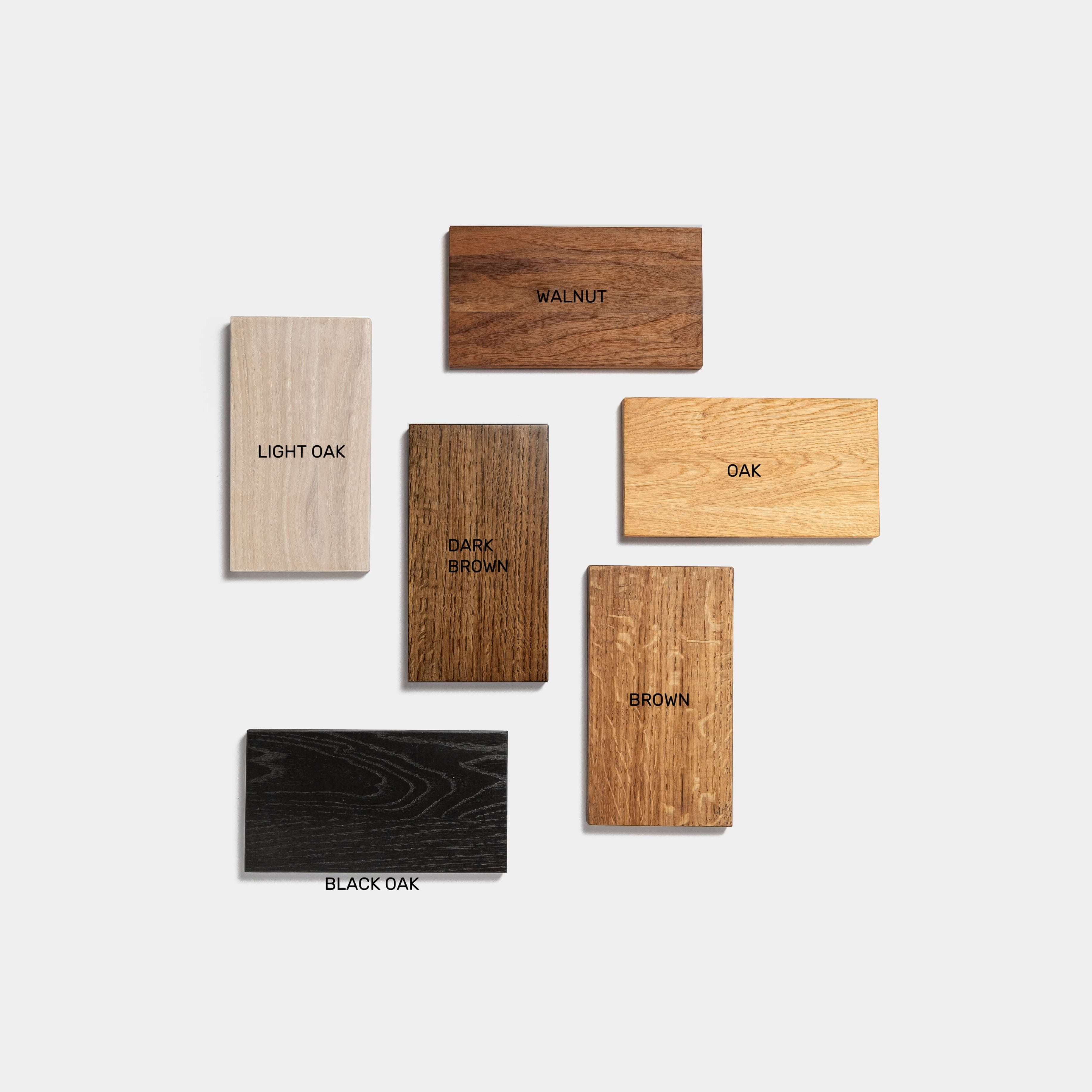 Various wood samples for Desk ORIGIN including light oak, black oak, walnut, and oak.