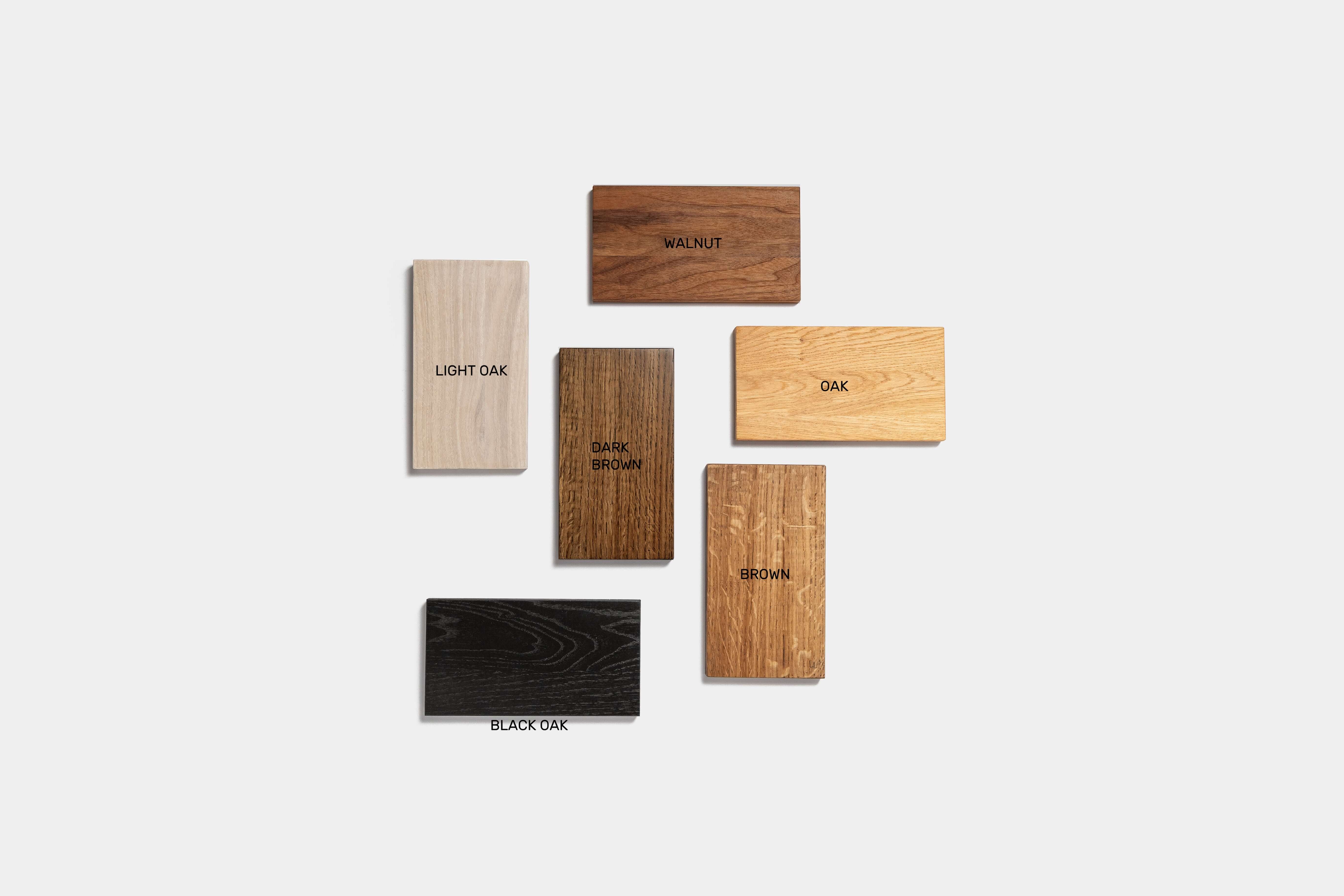 Various wood samples for Desk ORIGIN including light oak, black oak, walnut, and oak.