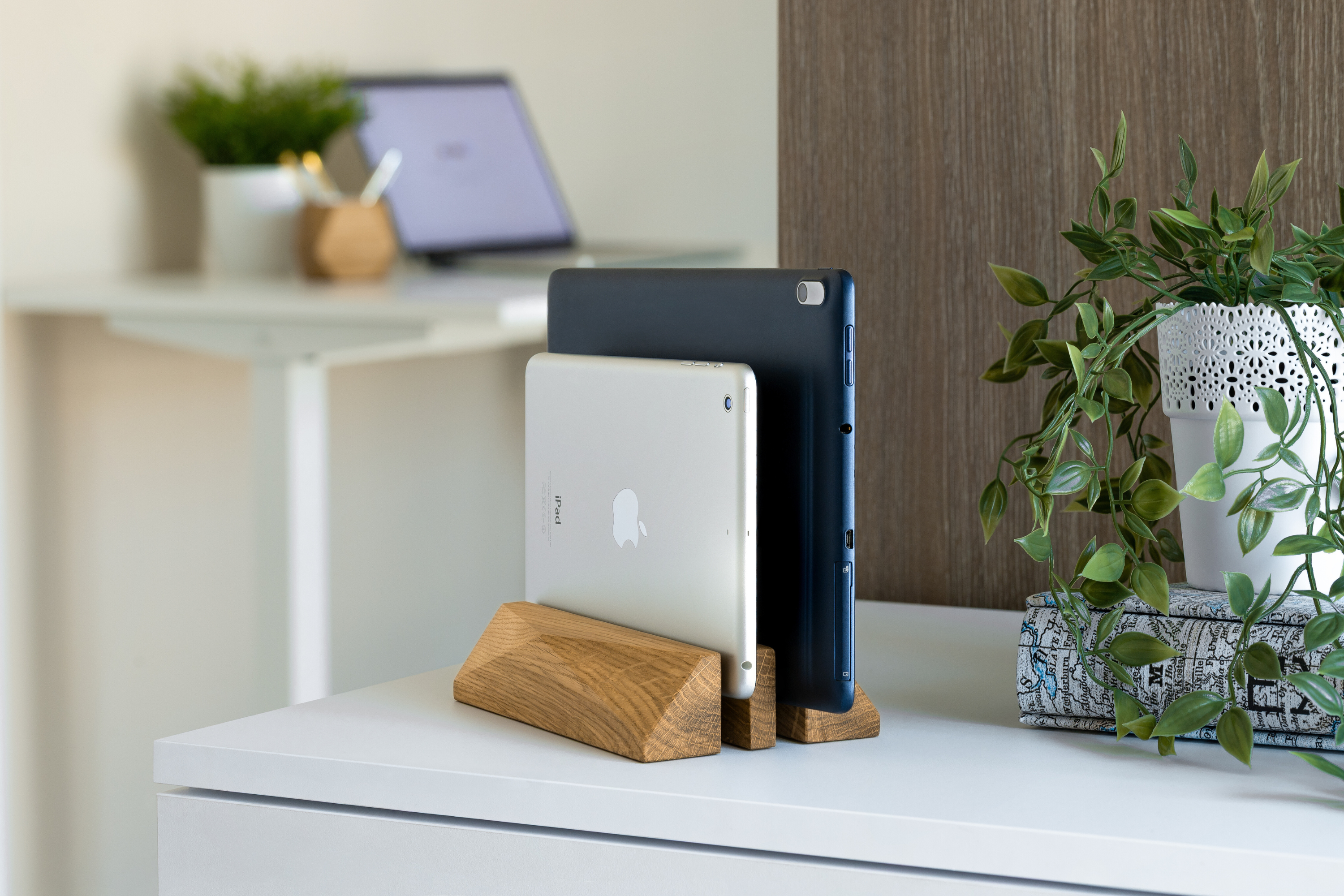 Dual Laptop Dock - Oak holding two devices in a minimalist workspace, enhancing organization and style.