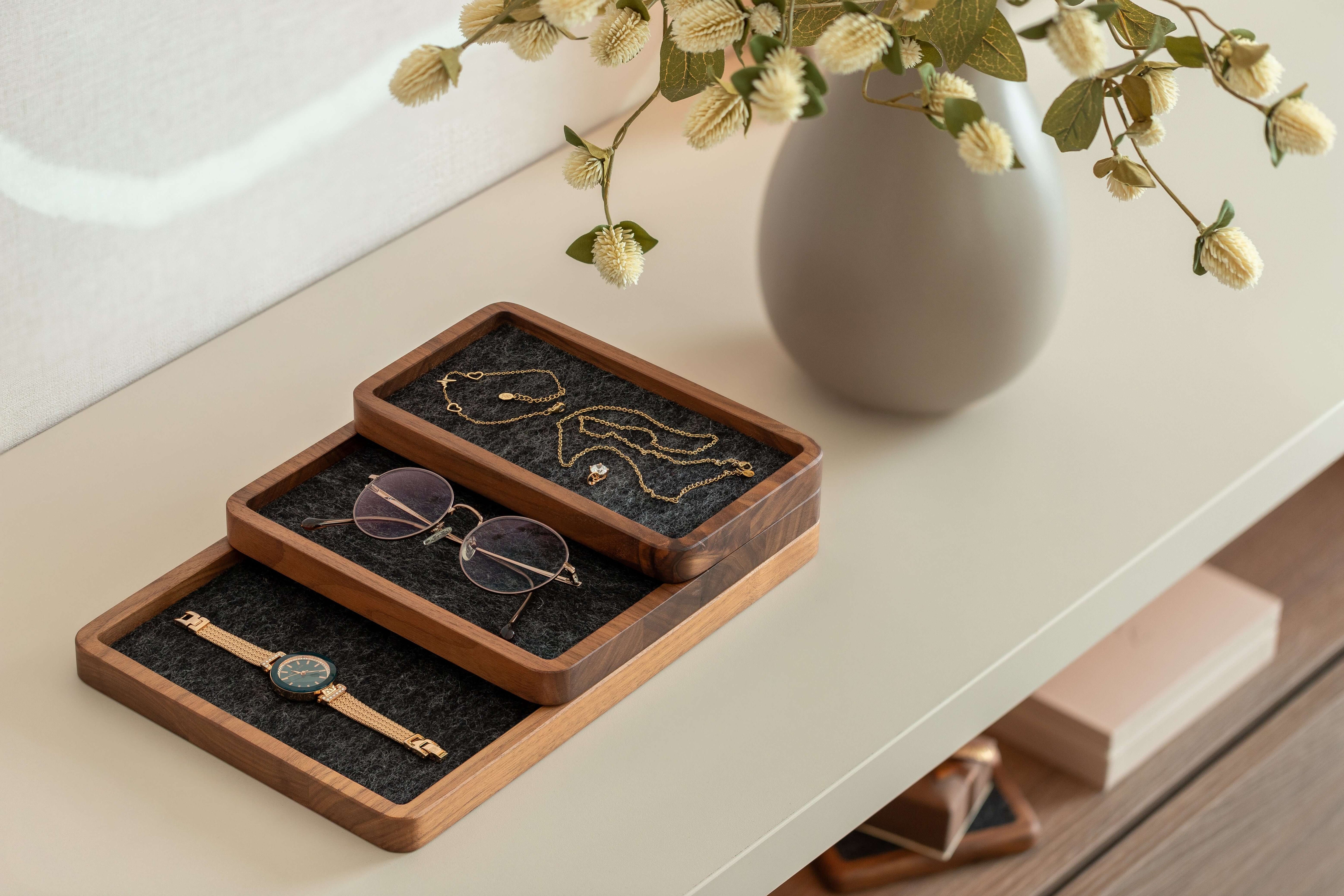 Catch All Tray in black oak finish organizing jewelry and accessories on a stylish desk surface.