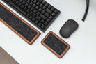 Mouse Wrist Rest - Walnut next to a keyboard and mouse on a desk, showcasing ergonomic design for comfort.