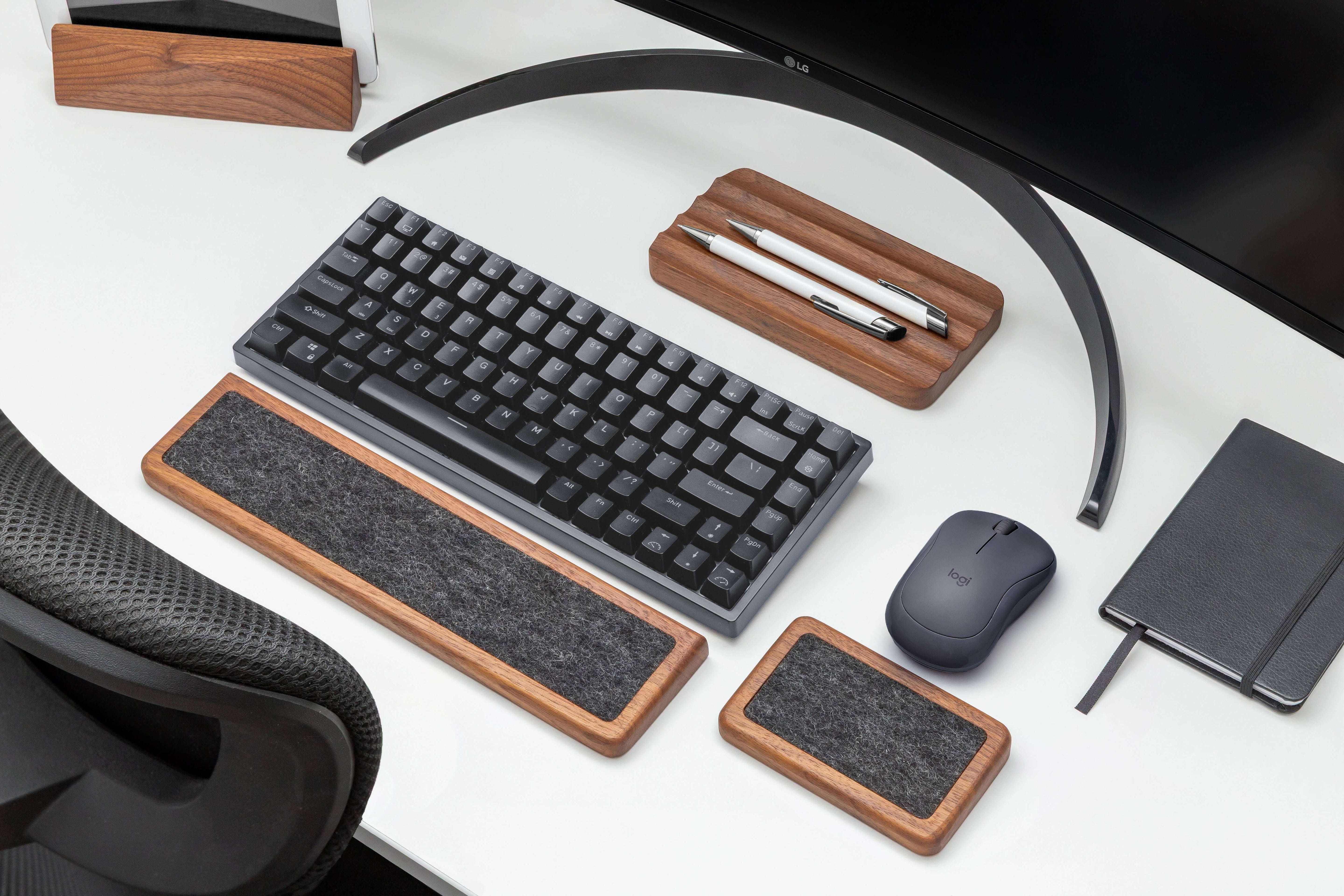 Keyboard wrist rest set in walnut combined with keyboard and mouse for ergonomic comfort on a workspace.
