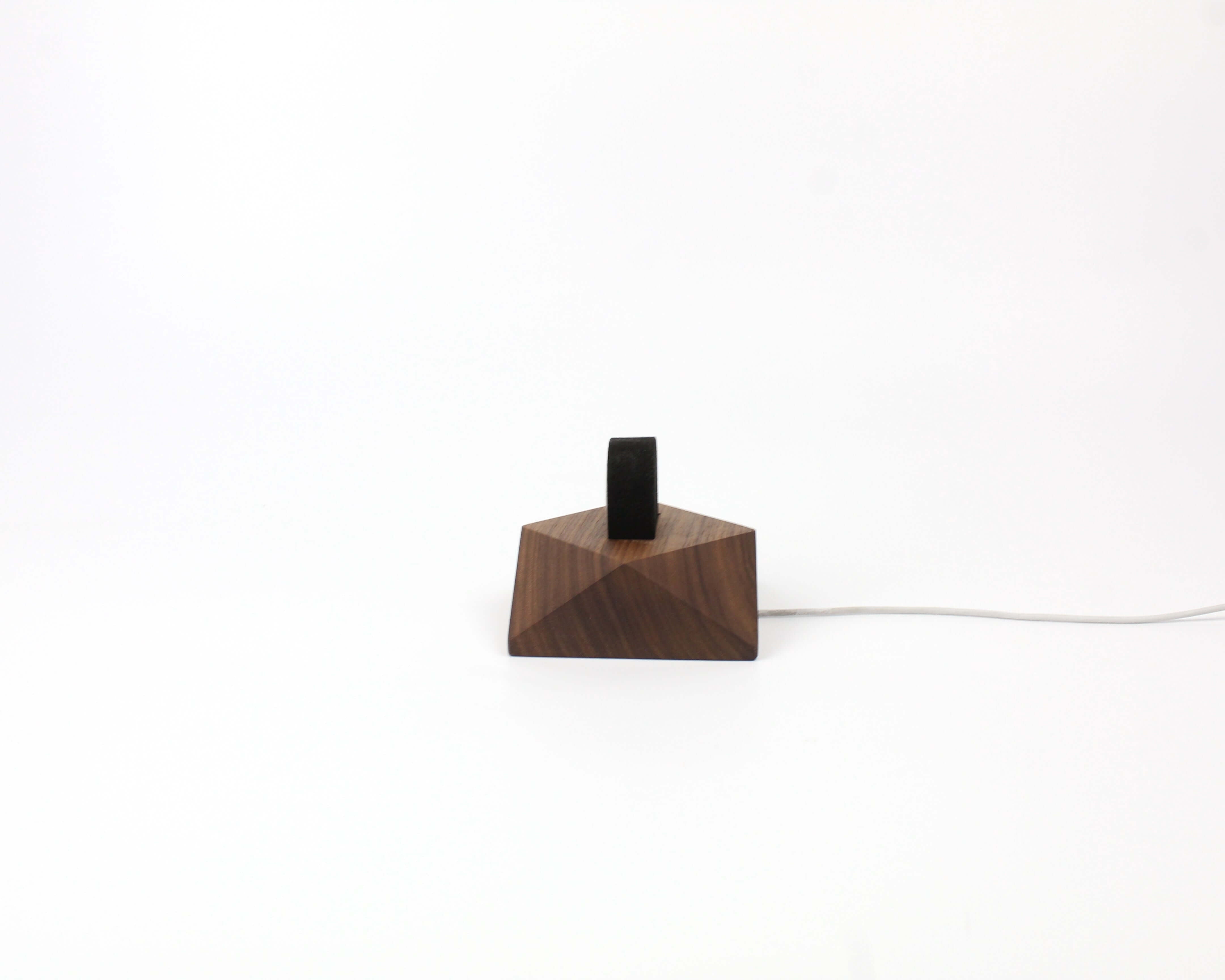 Apple Watch charging stand in walnut wood, elegantly designed for organization and style on desk or nightstand.