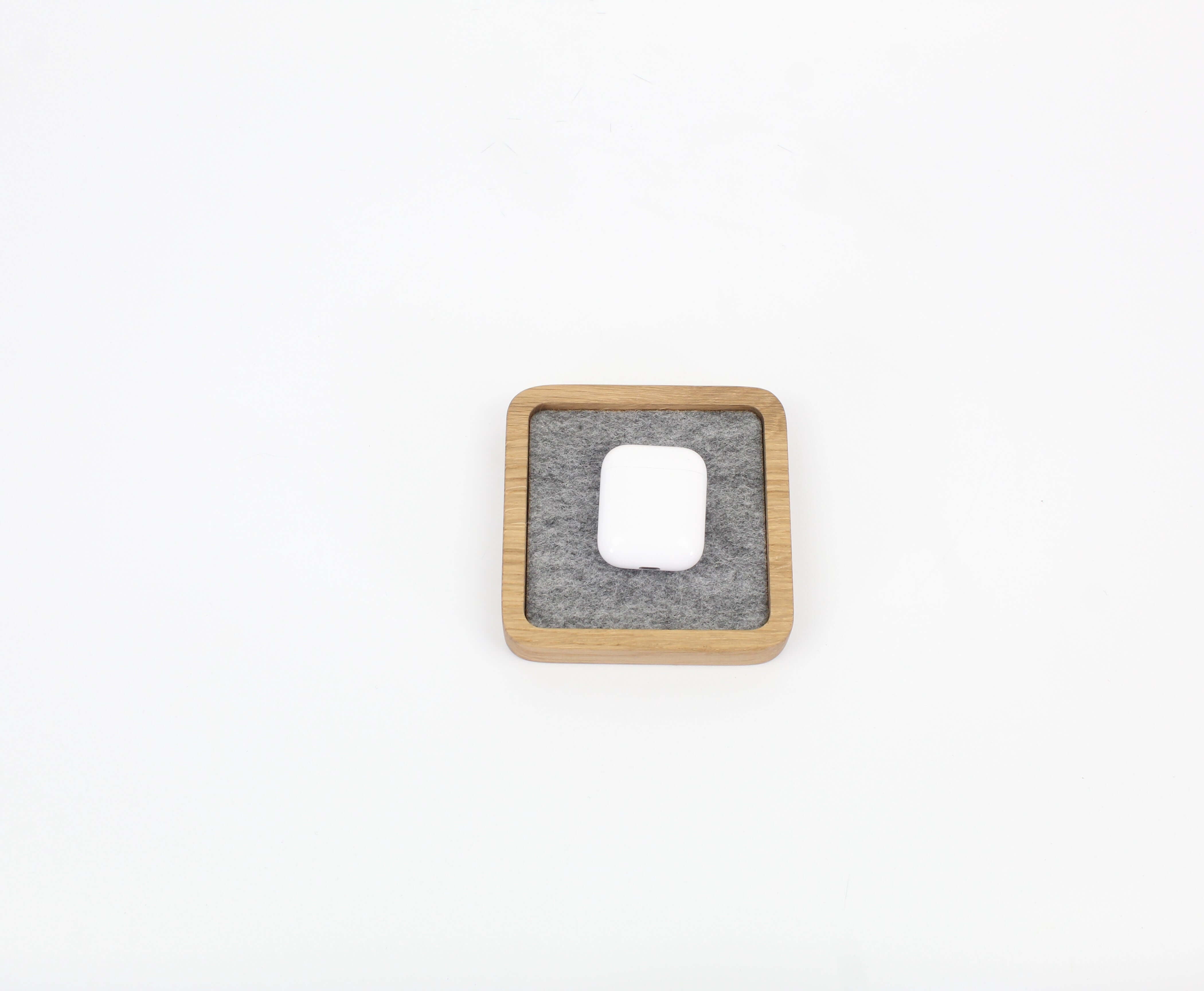 Small oak desk tray featuring a felt insert, perfect for organizing accessories and keeping your workspace tidy.