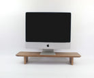 Wood monitor stand - walnut desk shelf for optimal workspace organization and ergonomic viewing.