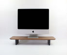 Walnut desk shelf monitor riser enhancing workspace organization and aesthetics.